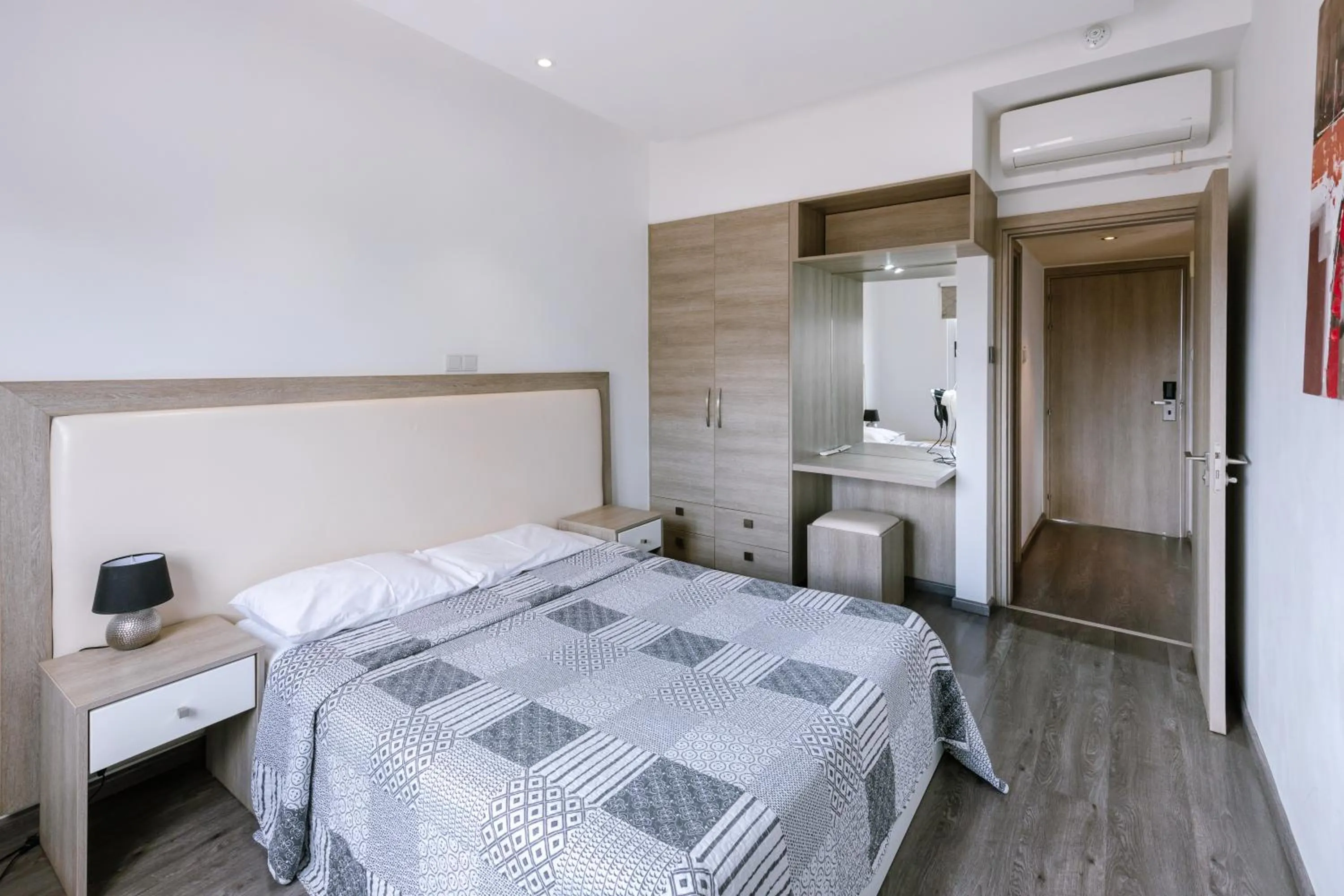 Bed in Neptune Hotel Apartments Paphos