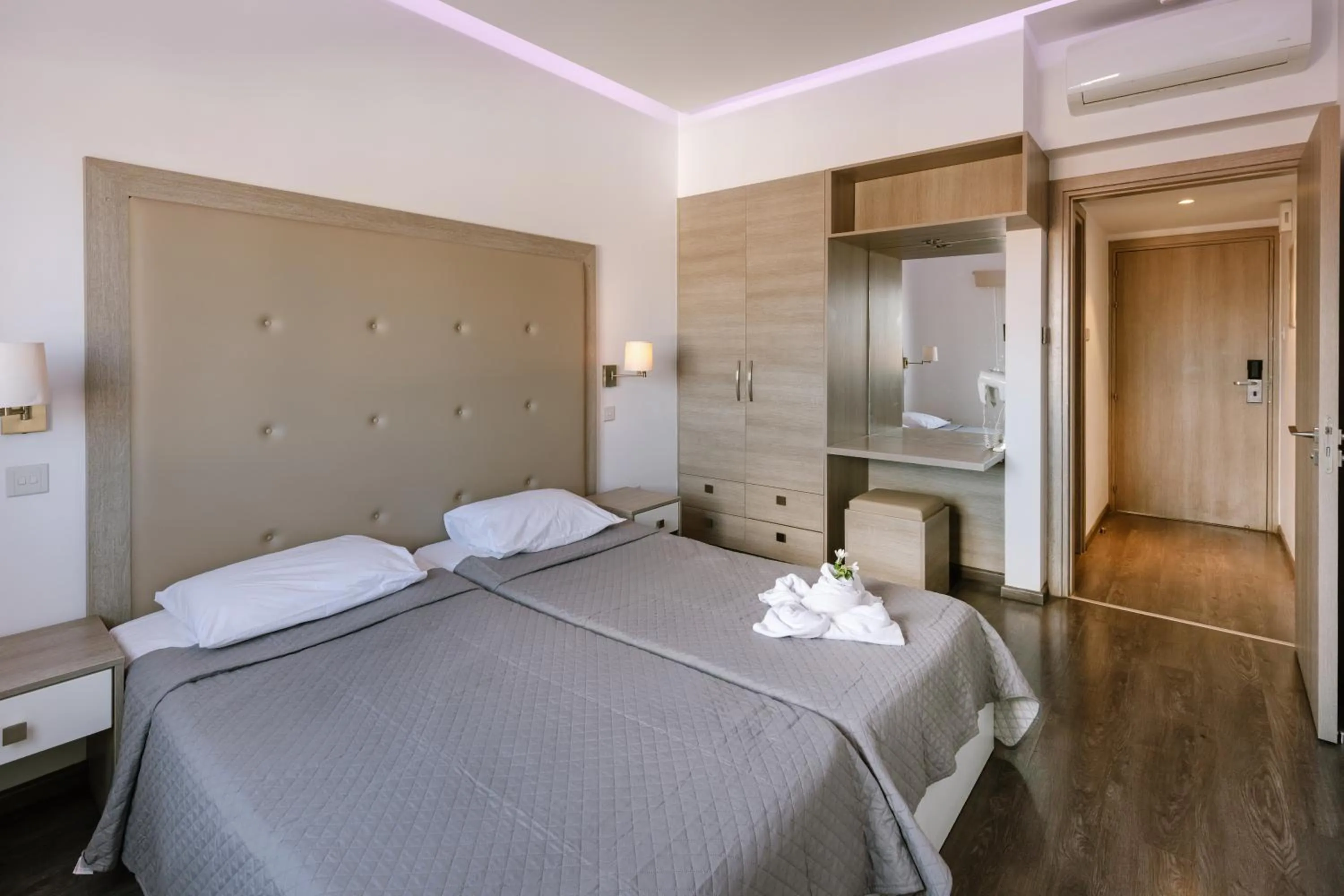 Bed in Neptune Hotel Apartments Paphos