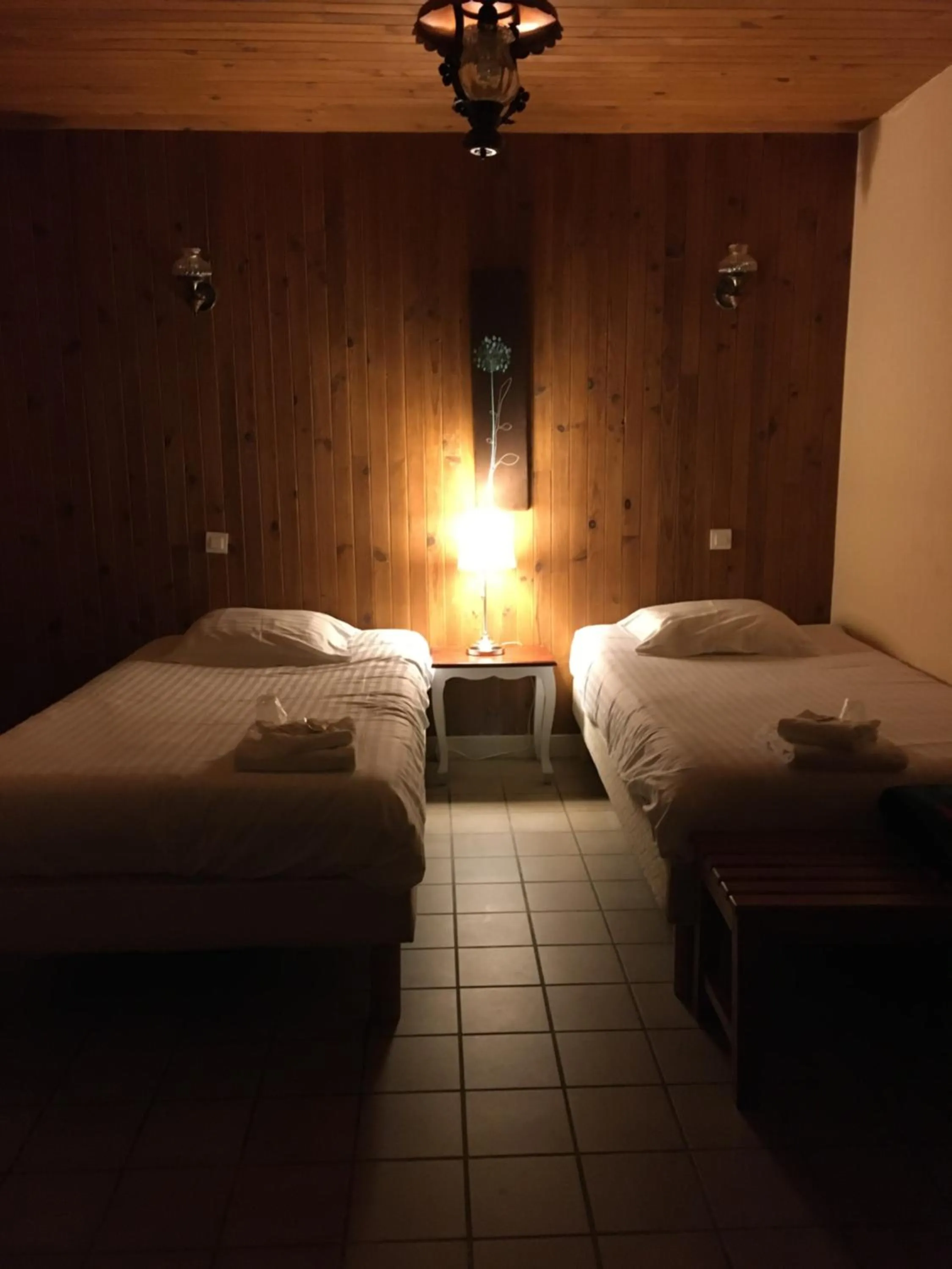 Bed in Hôtel du Commerce