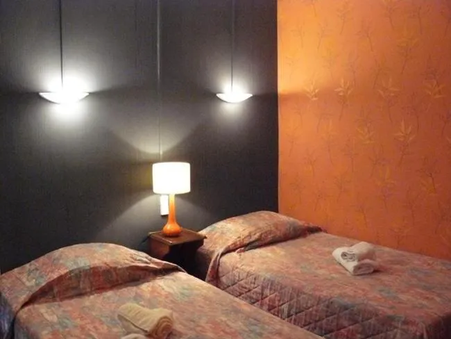 Photo of the whole room, Bed in Hôtel du Commerce