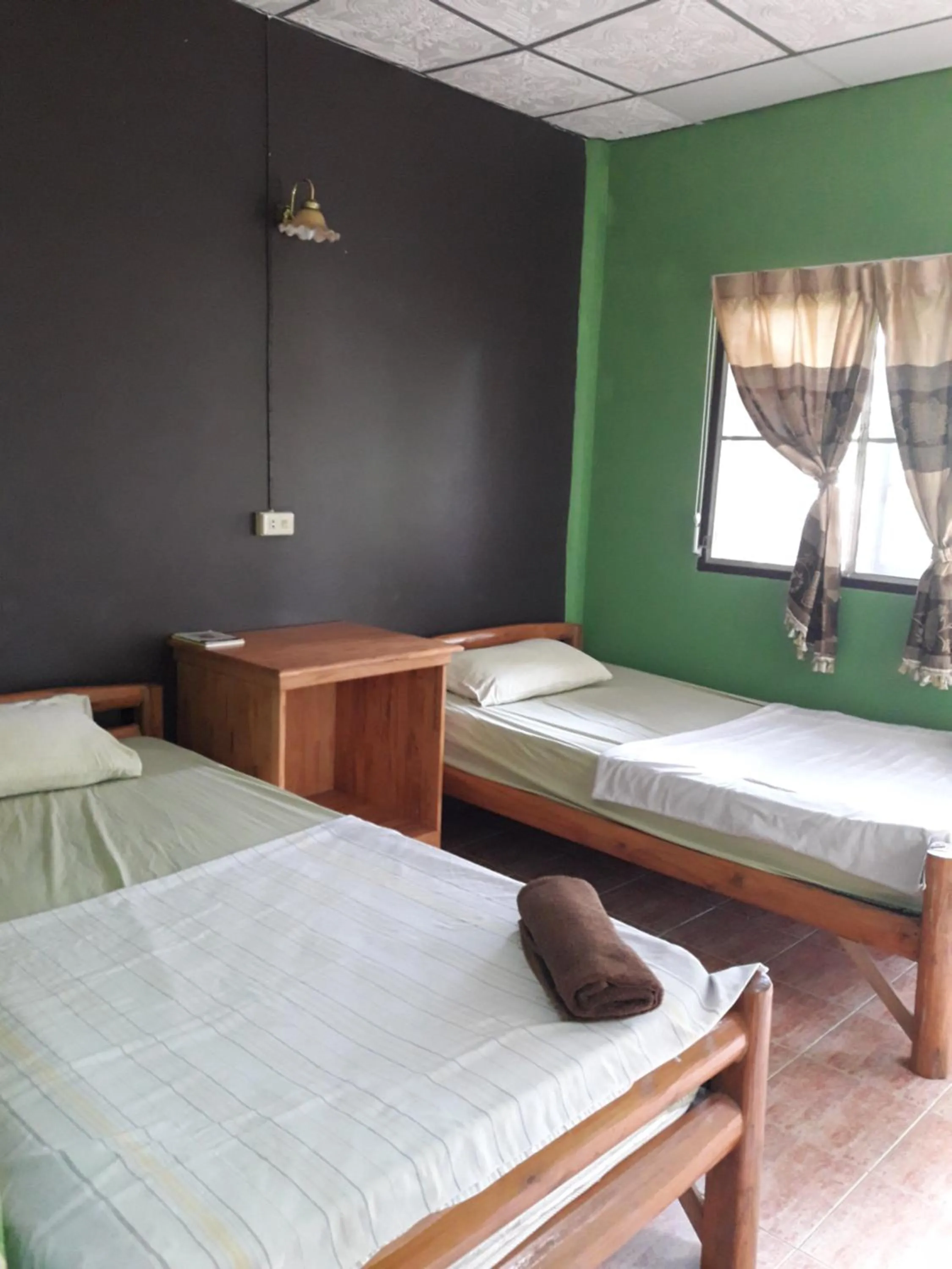 Bed in Jungle Hut Bungalows & Hotel