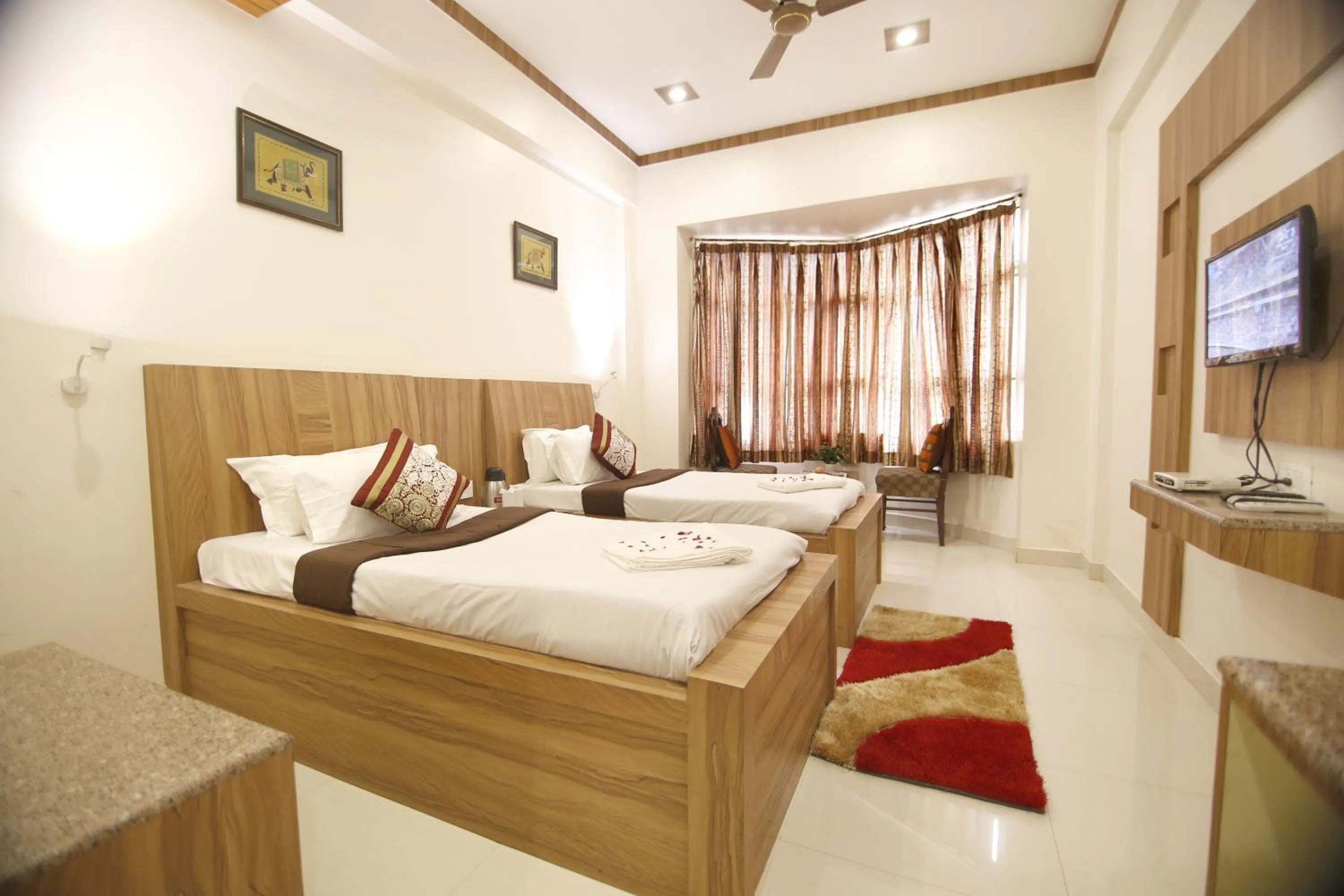 Bedroom, Bed in Hotel Sheetal Regency,Near Janambhumi