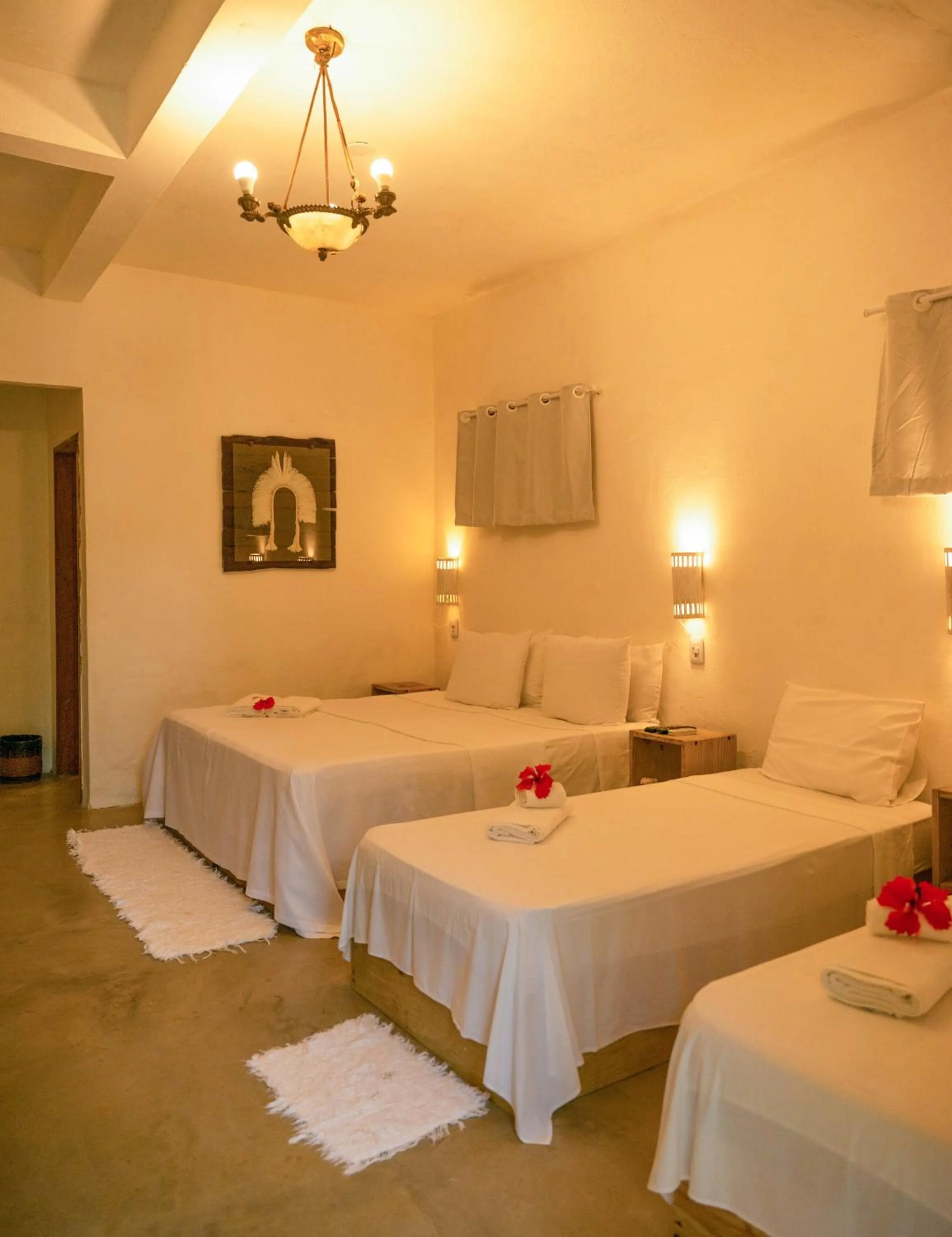 Bed in Pousada Raízes do Brasil