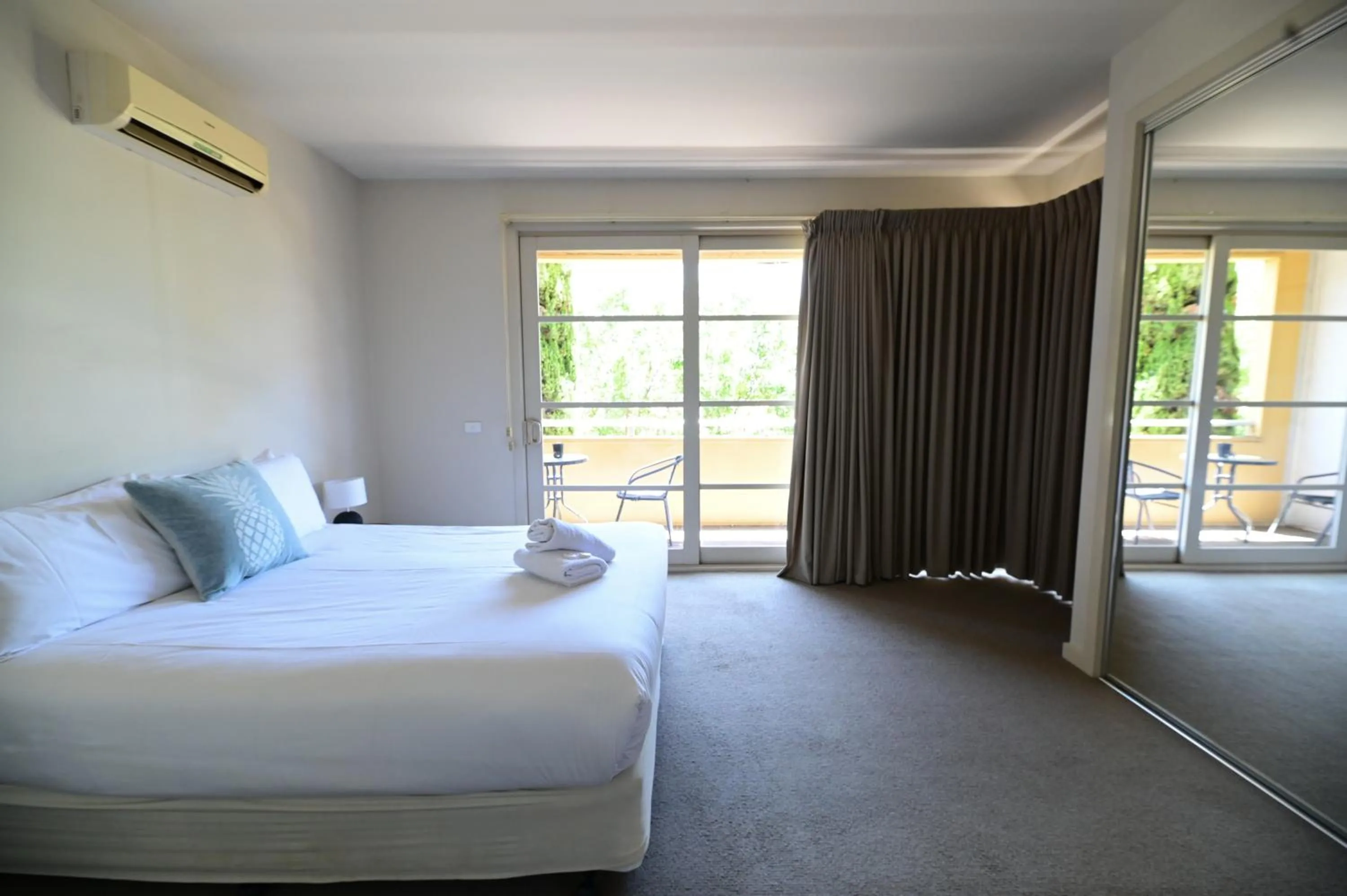 Bed in Central Shepparton Apartments
