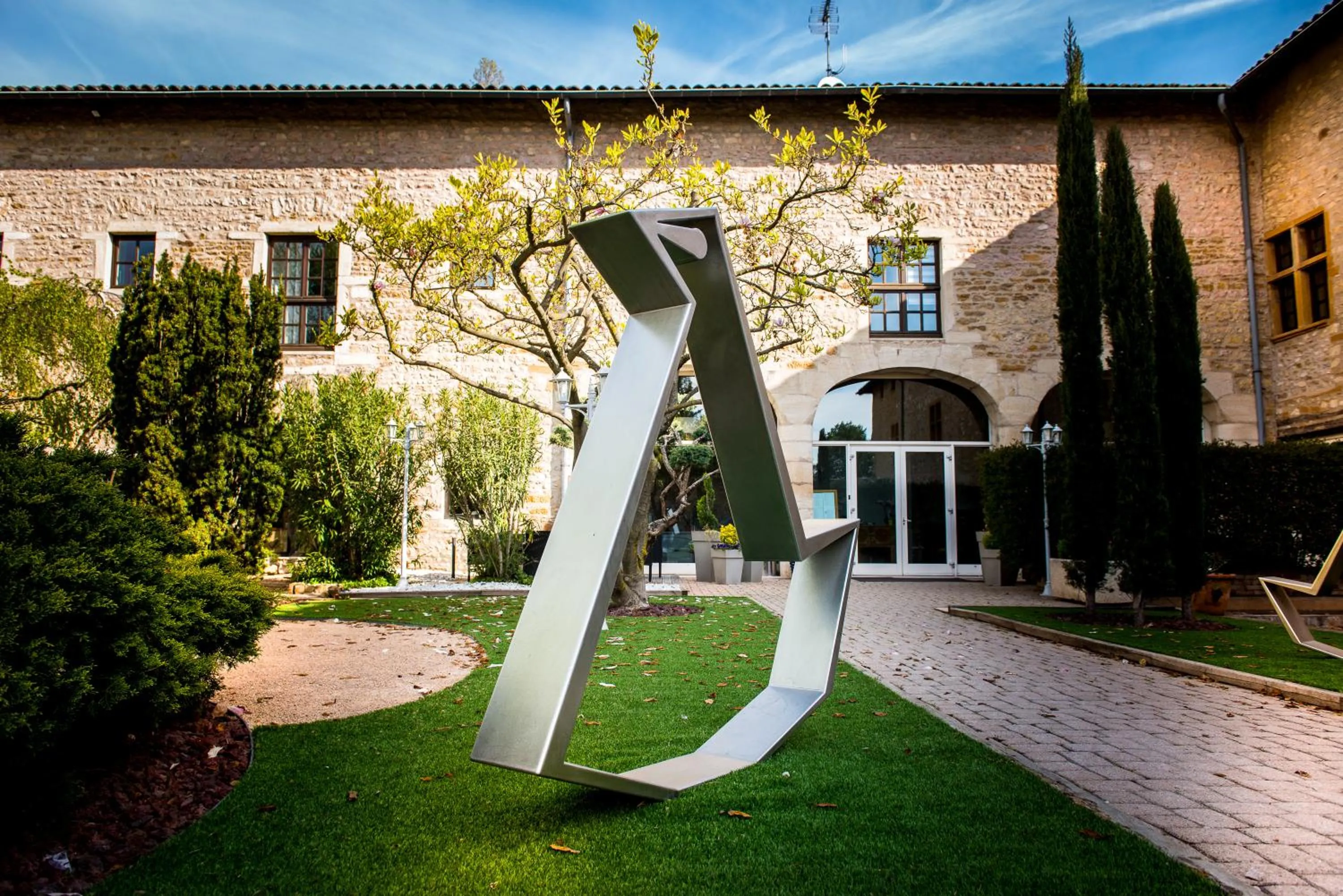 Property building in Demeures et Chateaux l'Abbaye Caladoise - Anciennement Hostellerie Ferme du Poulet