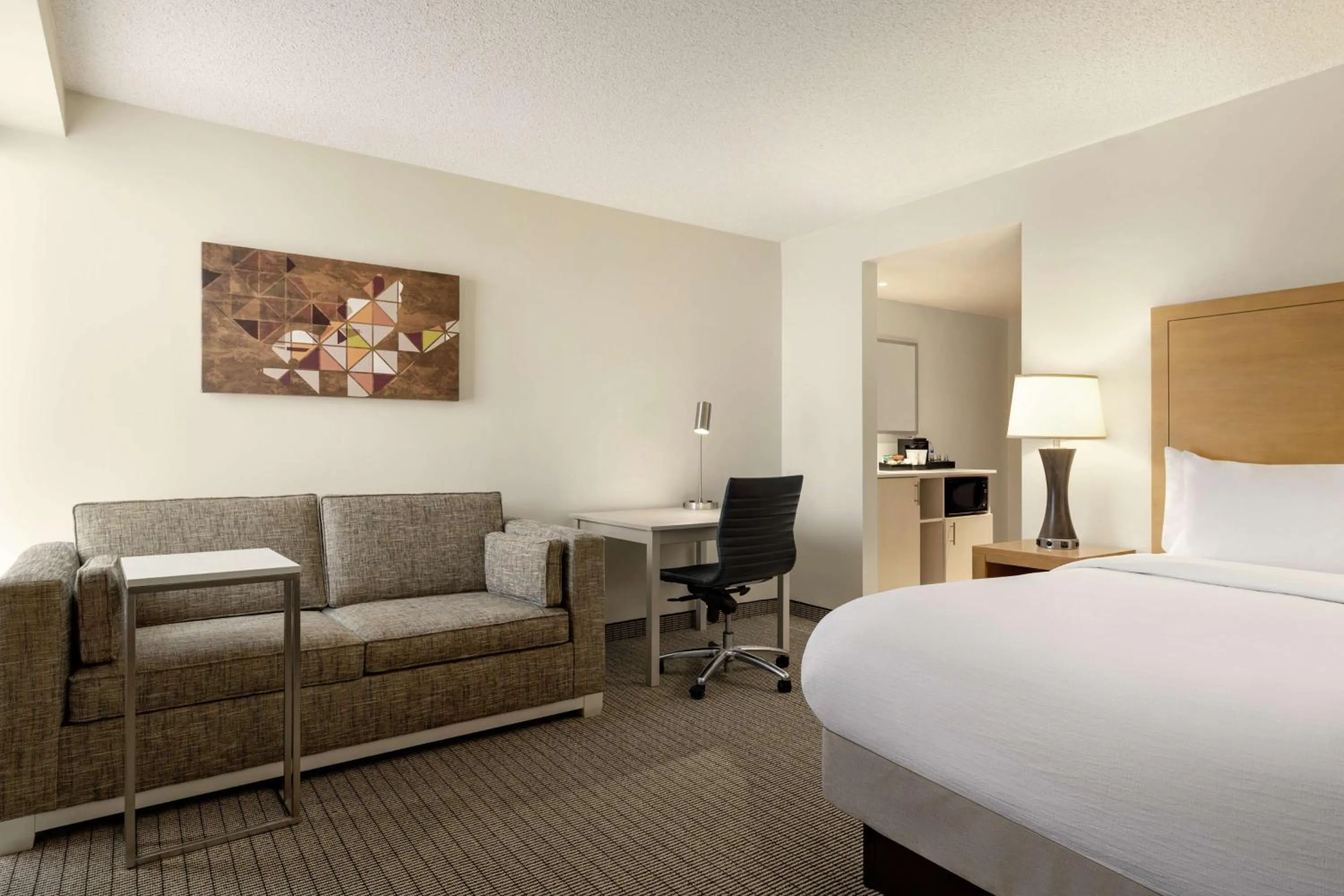 Living room, Bed in Embassy Suites by Hilton Denver International Airport