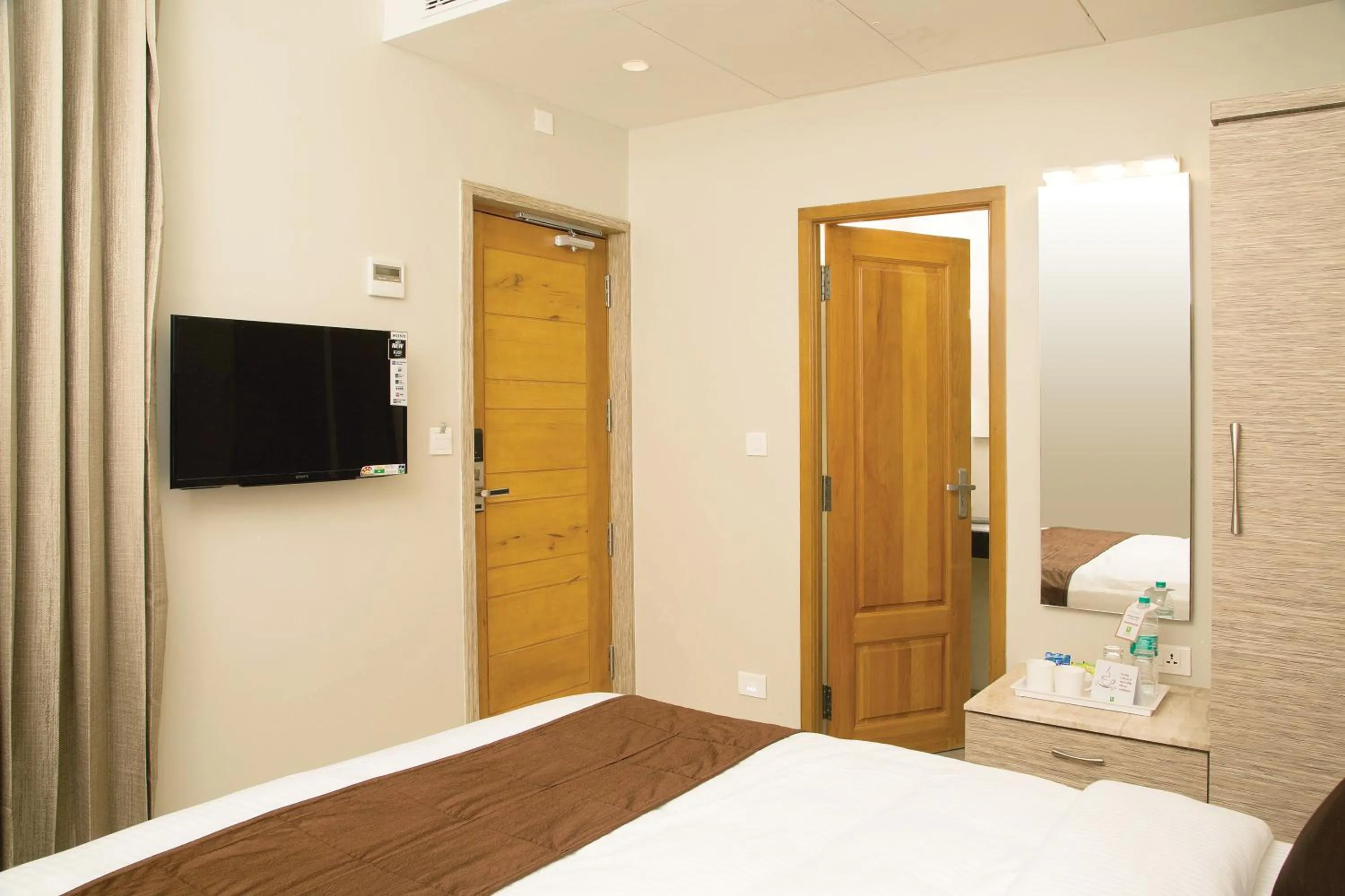 TV and multimedia, Bed in Sri Aadhish Grand Hotel