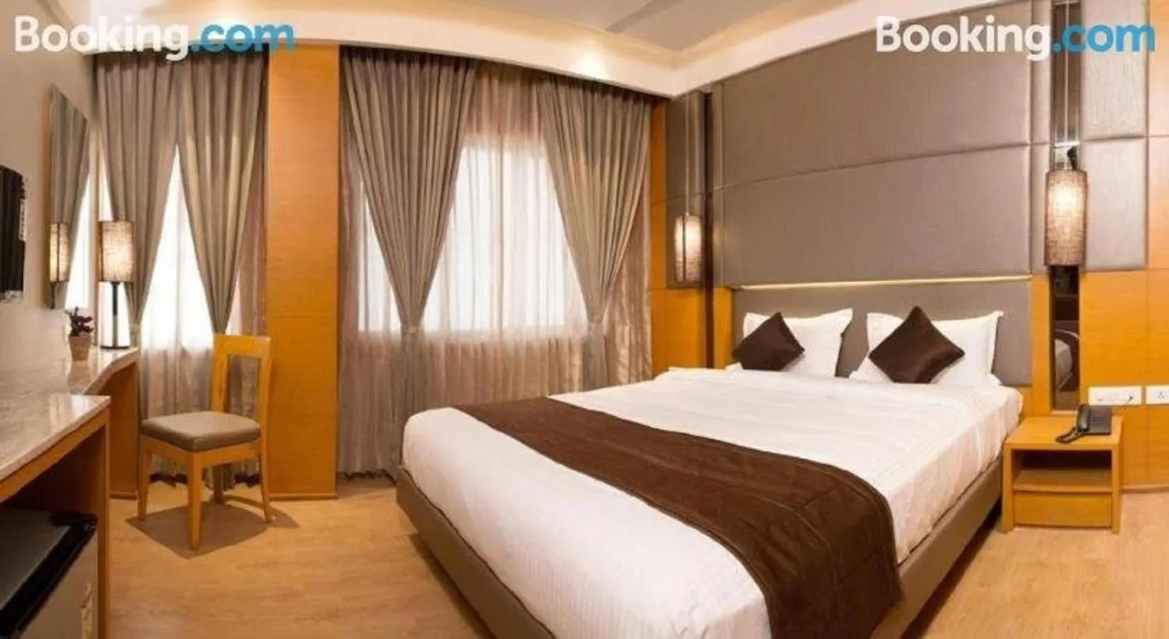 Bed in Sri Aadhish Grand Hotel