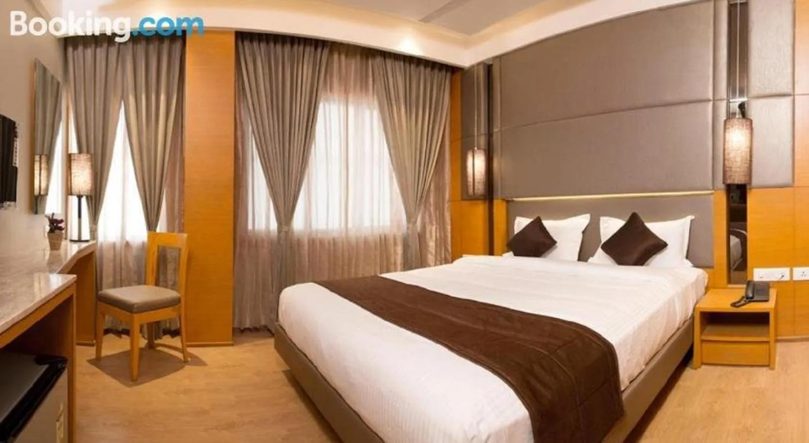 Bed in Sri Aadhish Grand Hotel