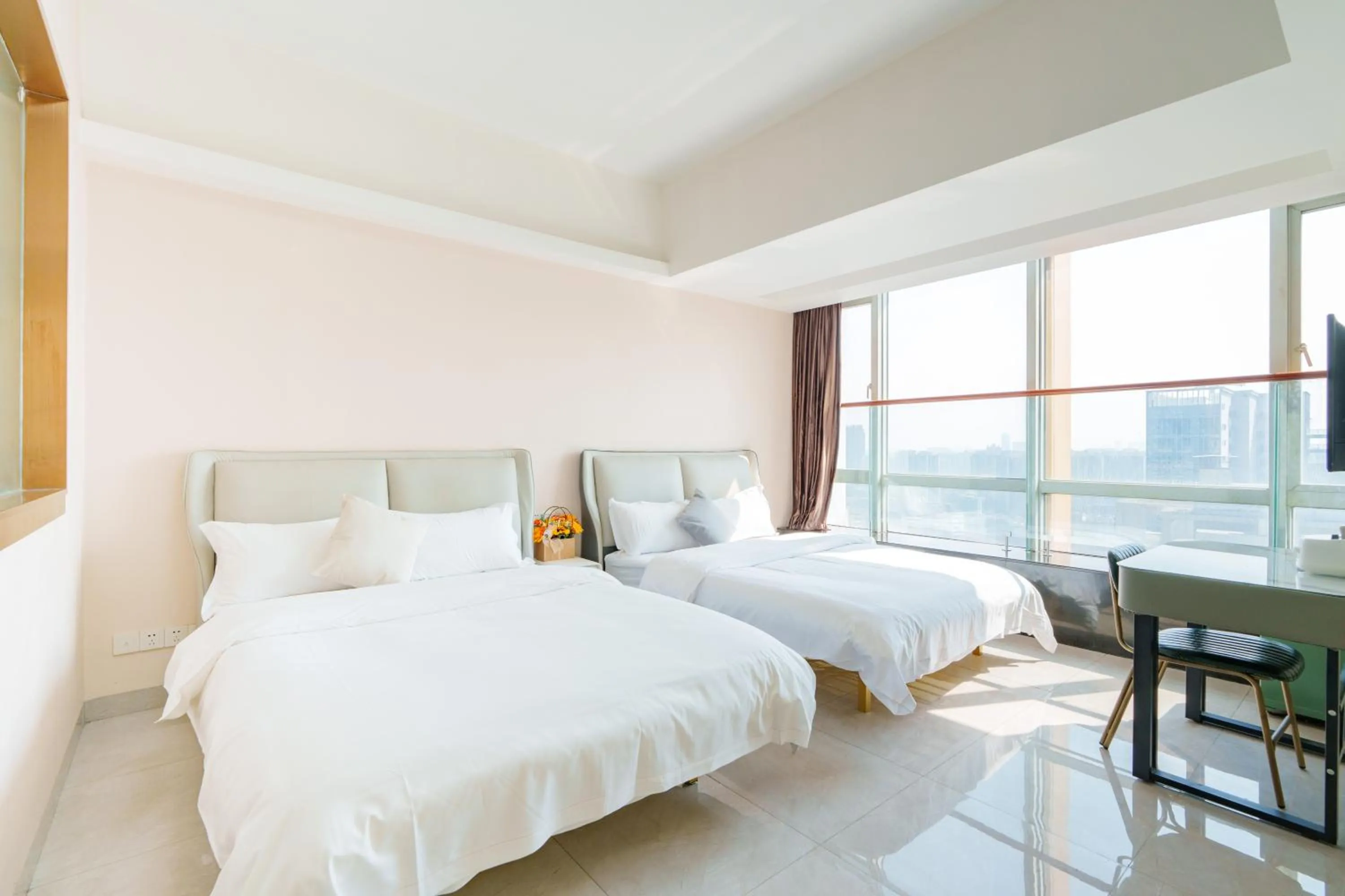 Bed in Sunny International Apartment From Beijing Road