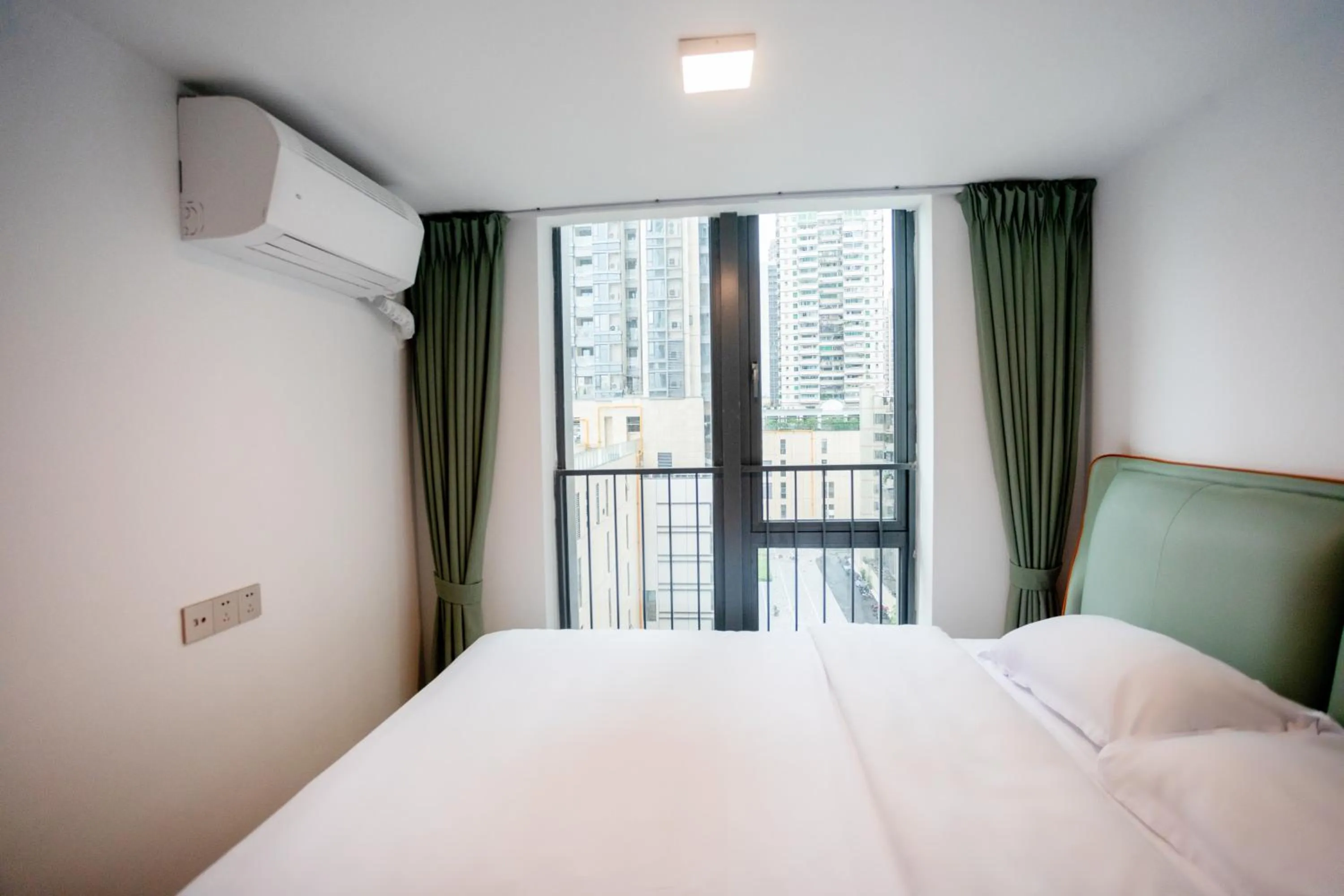 Bedroom, Bed in Sunny International Apartment From Beijing Road