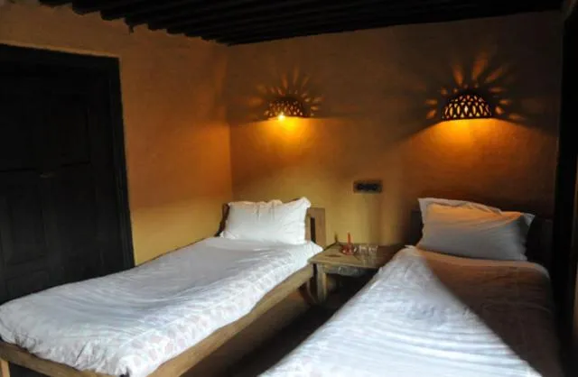 Photo of the whole room, Bed in Gaun Ghar Pvt Ltd