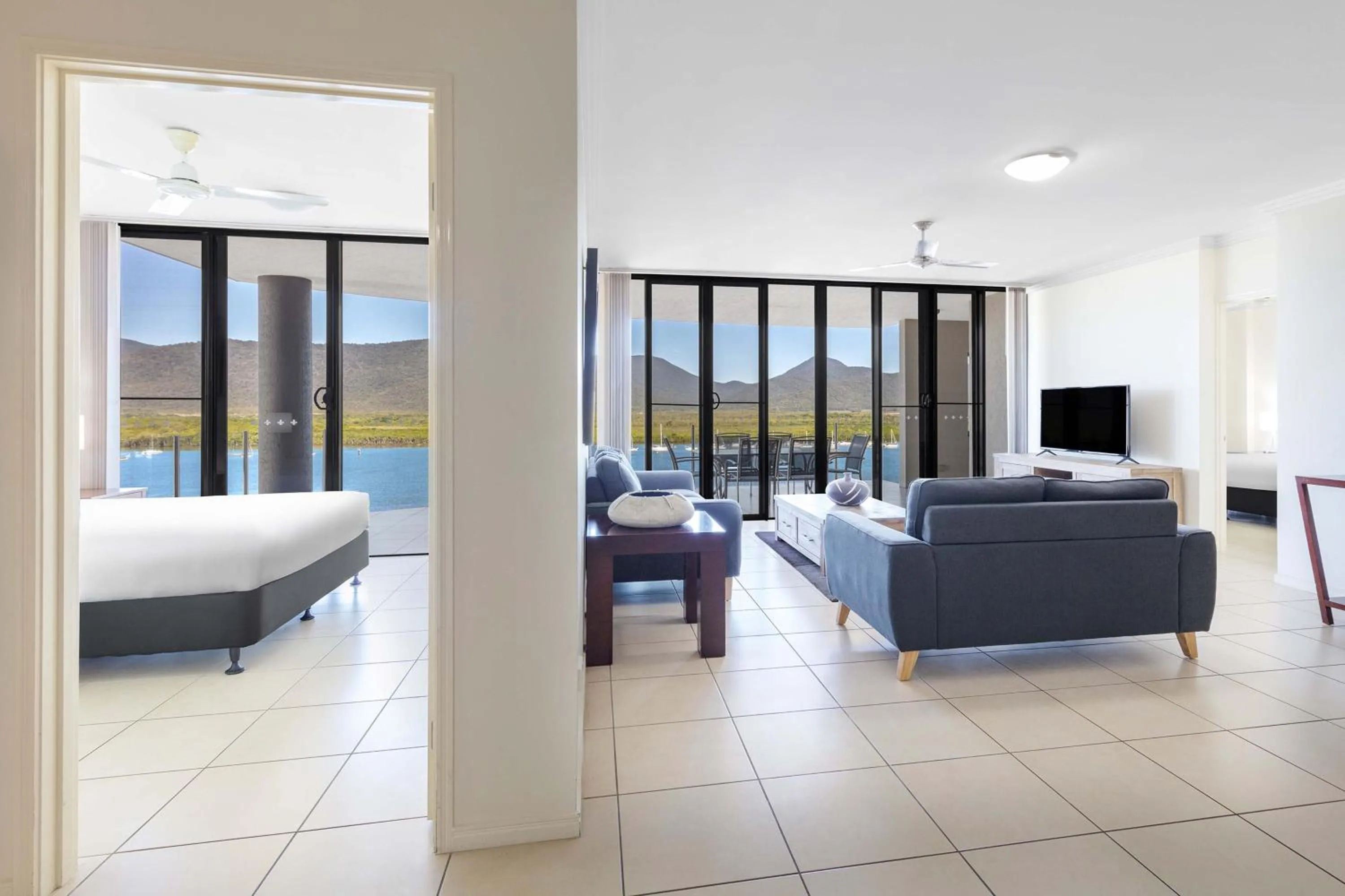 Living room, Bed in Piermonde Apartments Cairns