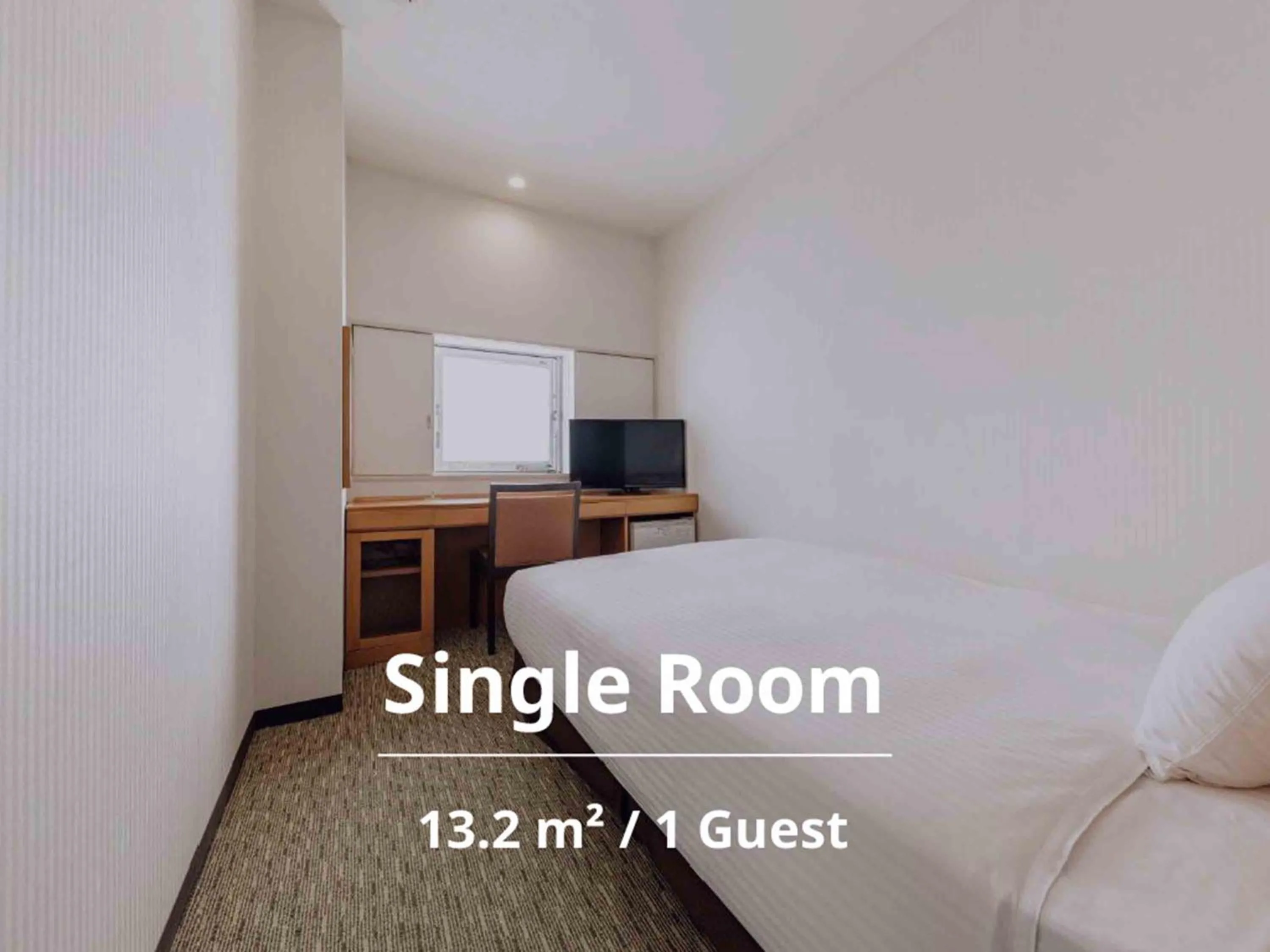 Bed in Nishitetsu Inn Kurosaki