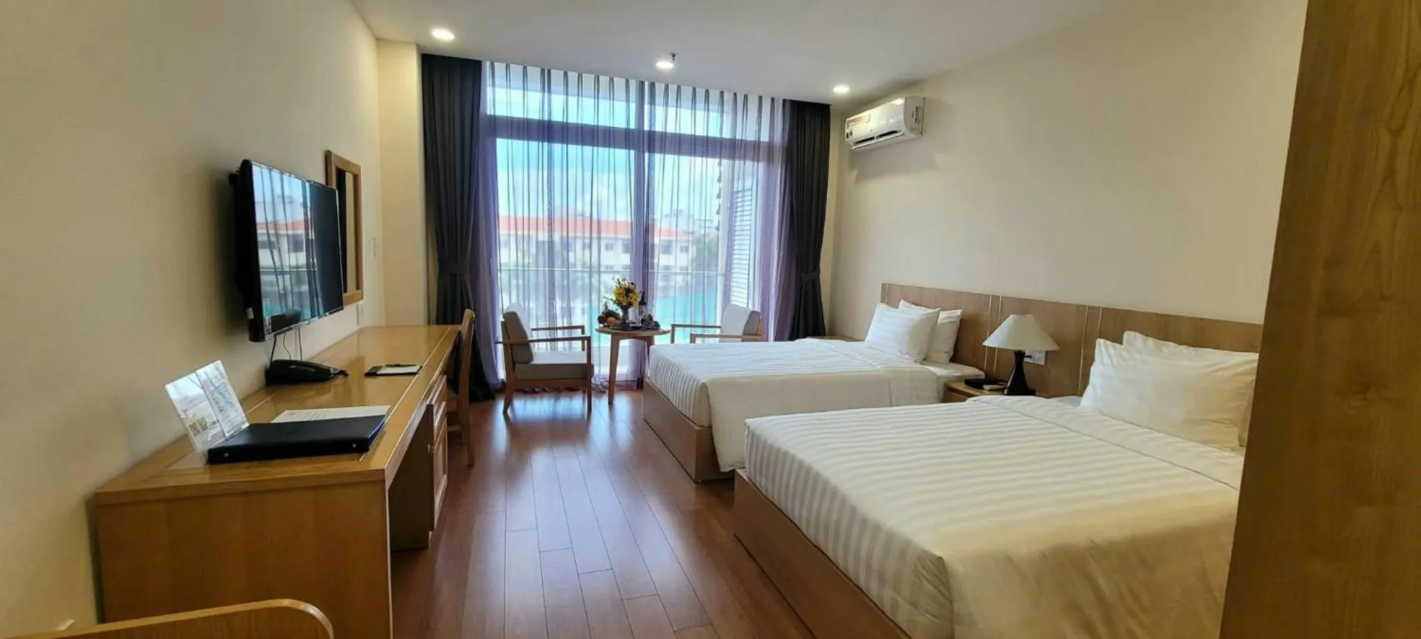 Bed in Sunflower Hotel & International Village