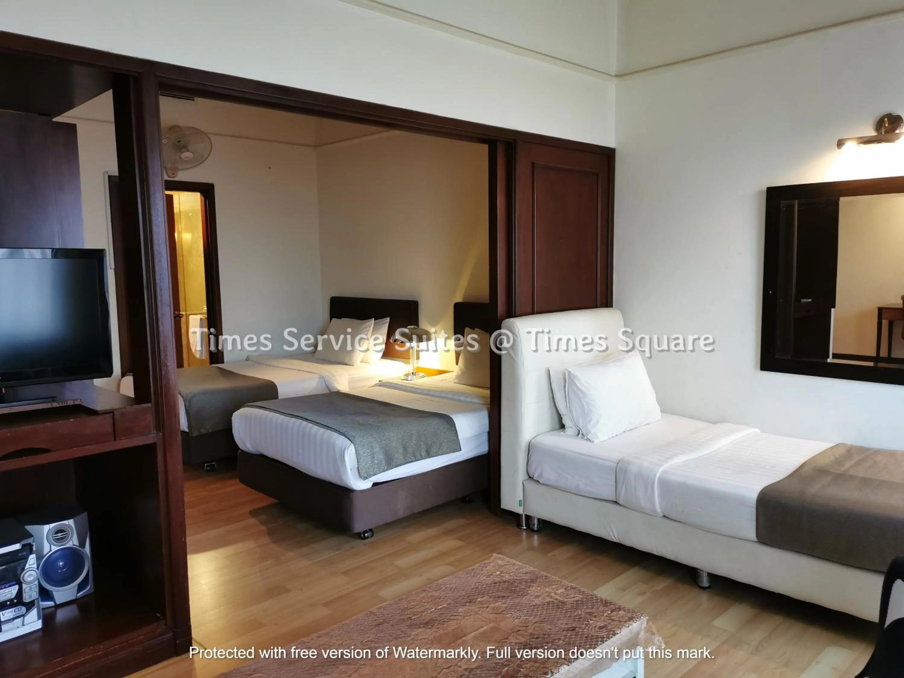 Living room, Bed in Times Service Suites @ Times Square