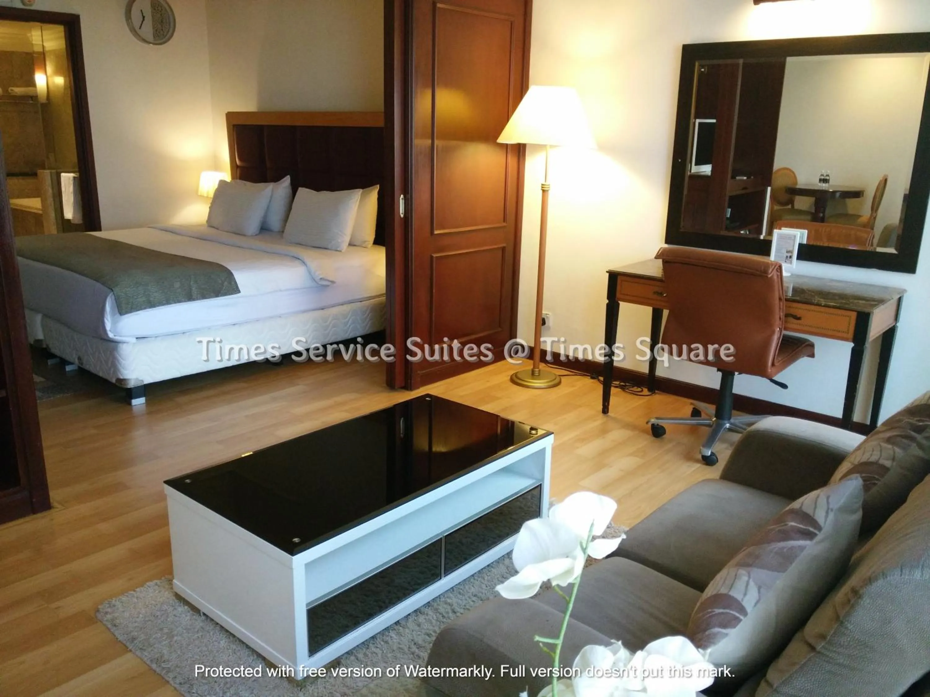 Living room, Bed in Times Service Suites @ Times Square