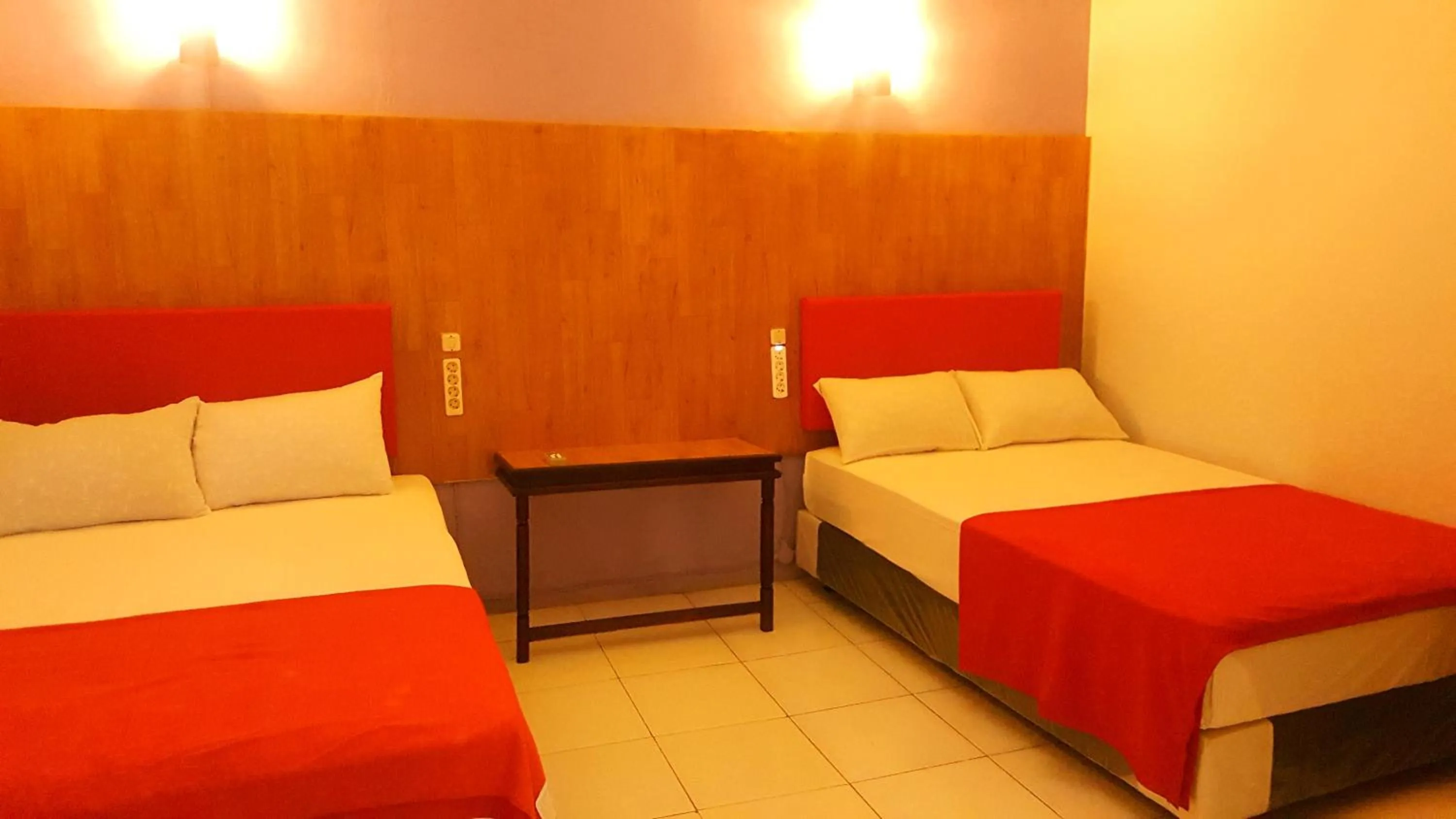 Bed in HOTEL SEGARA MANDALA