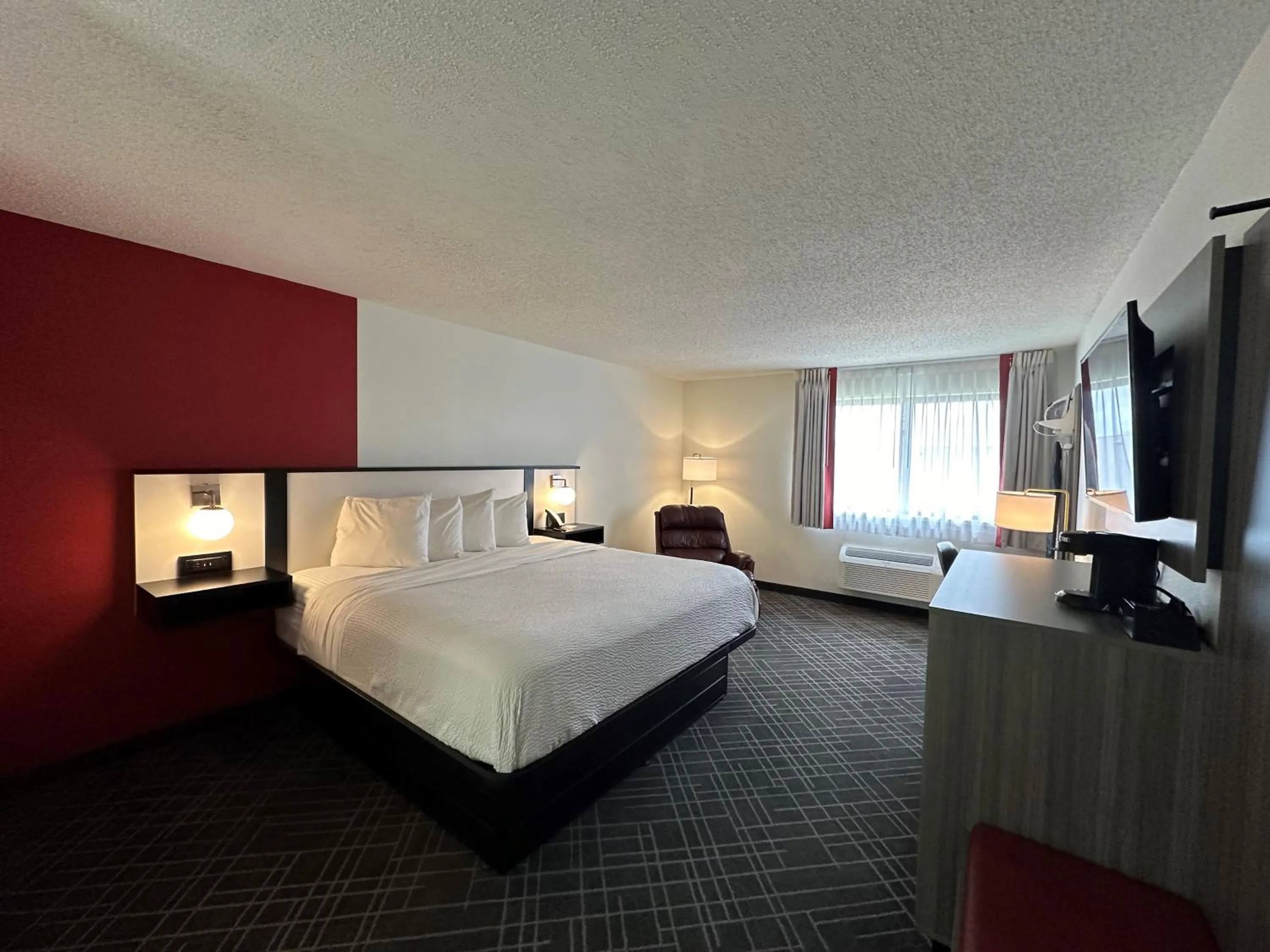 Bed in Ramada by Wyndham Waupaca