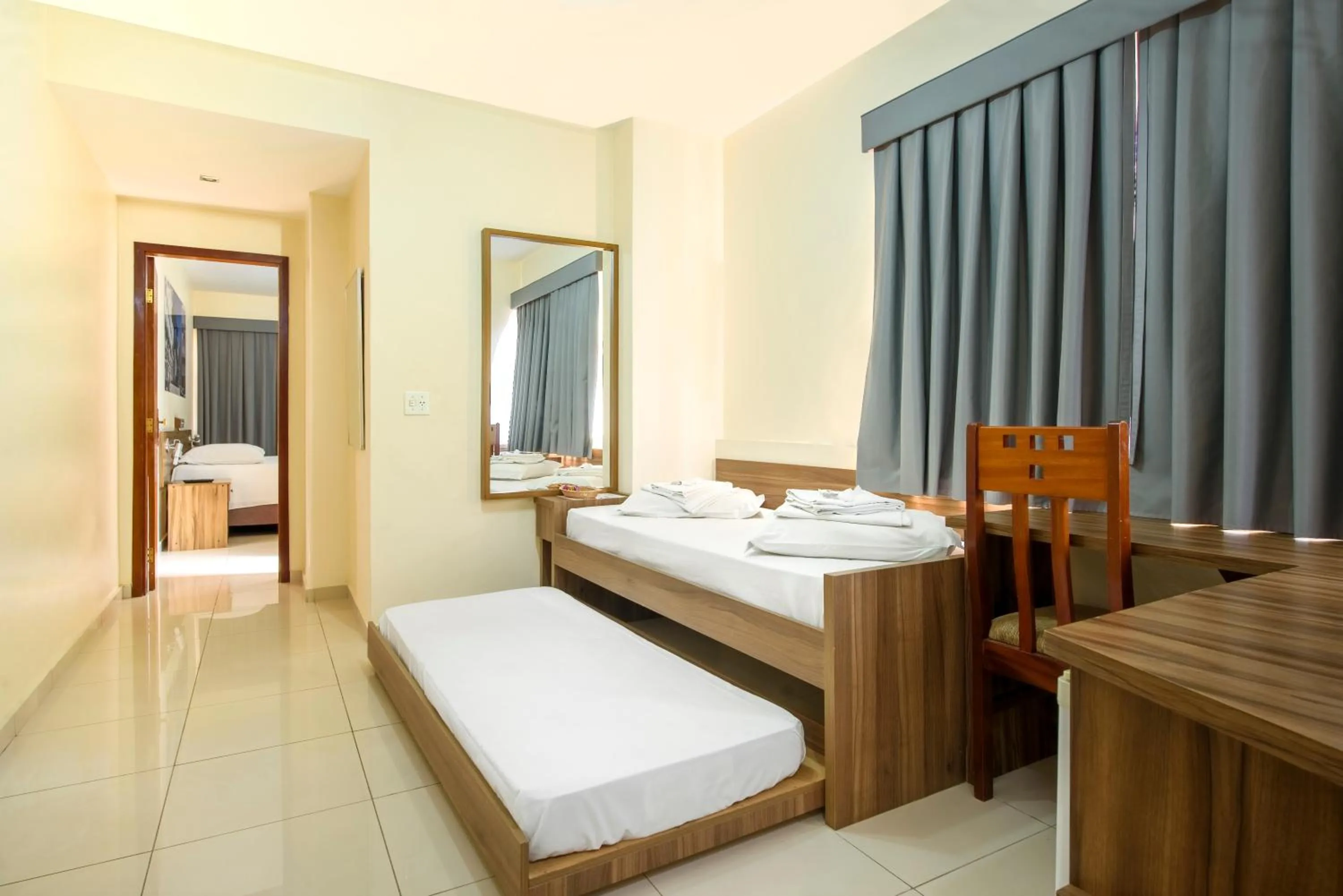 Bed in Plaza Suite Hotel