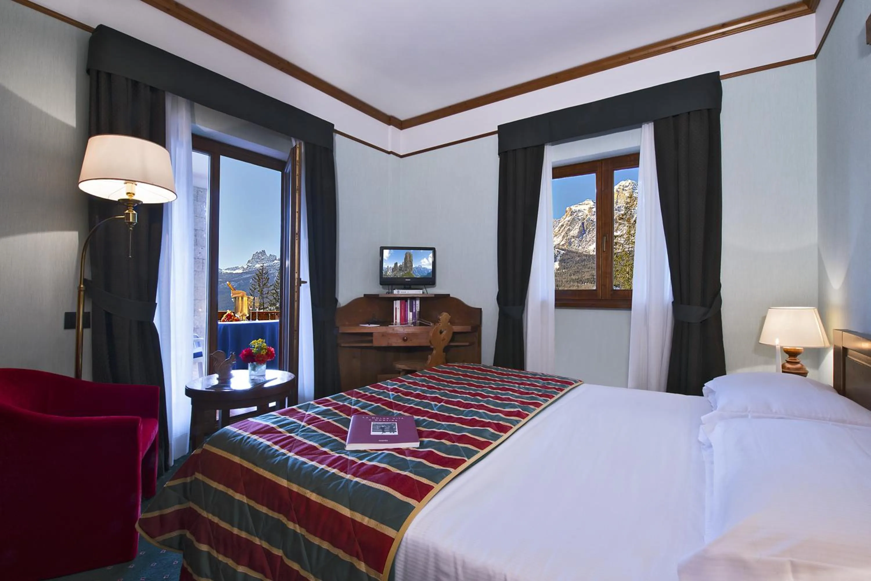 Photo of the whole room, Bed in Boutique Hotel Villa Blu Cortina D'Ampezzo