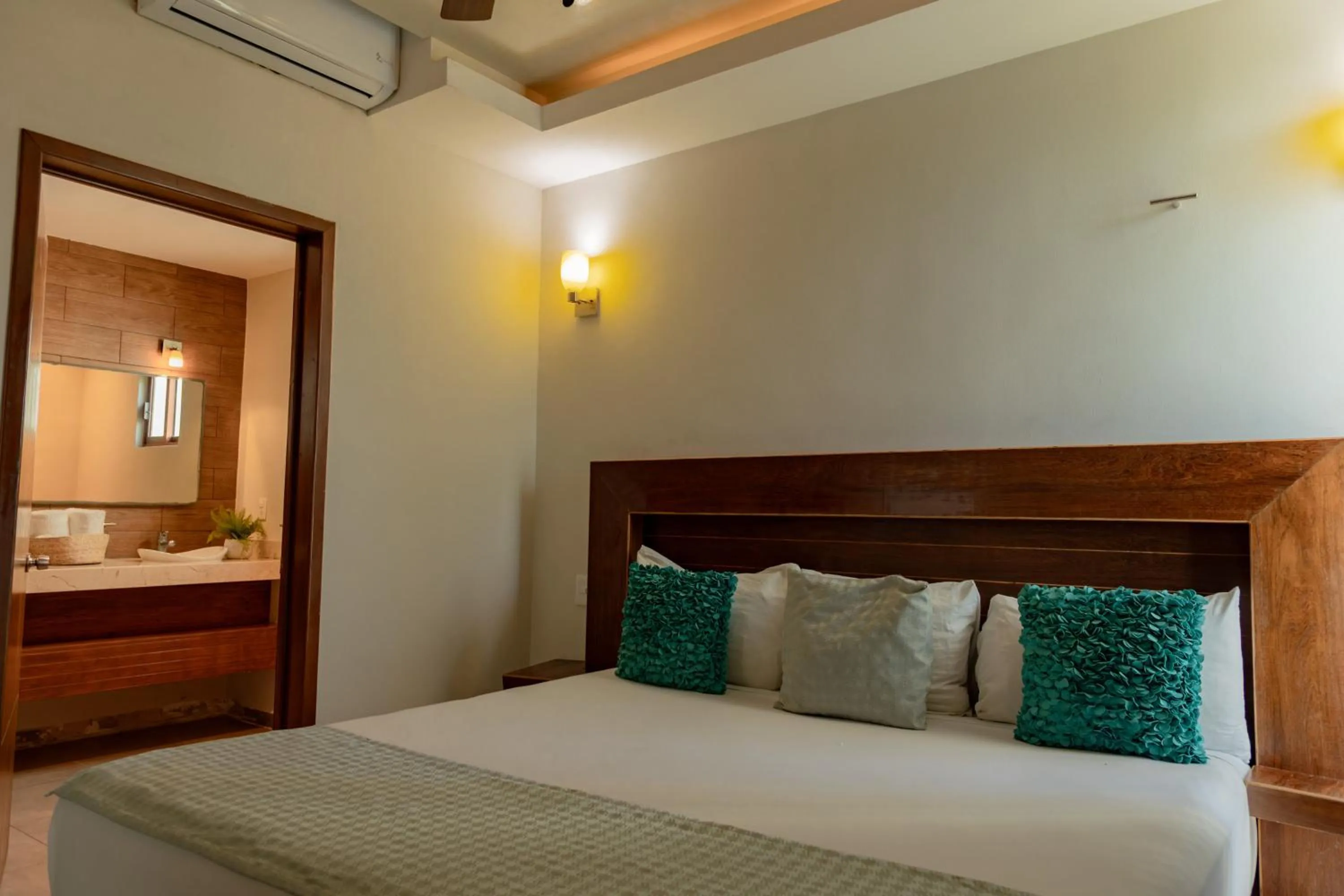 Bed in Aquastar Unique Hotel & Apartments Mahahual