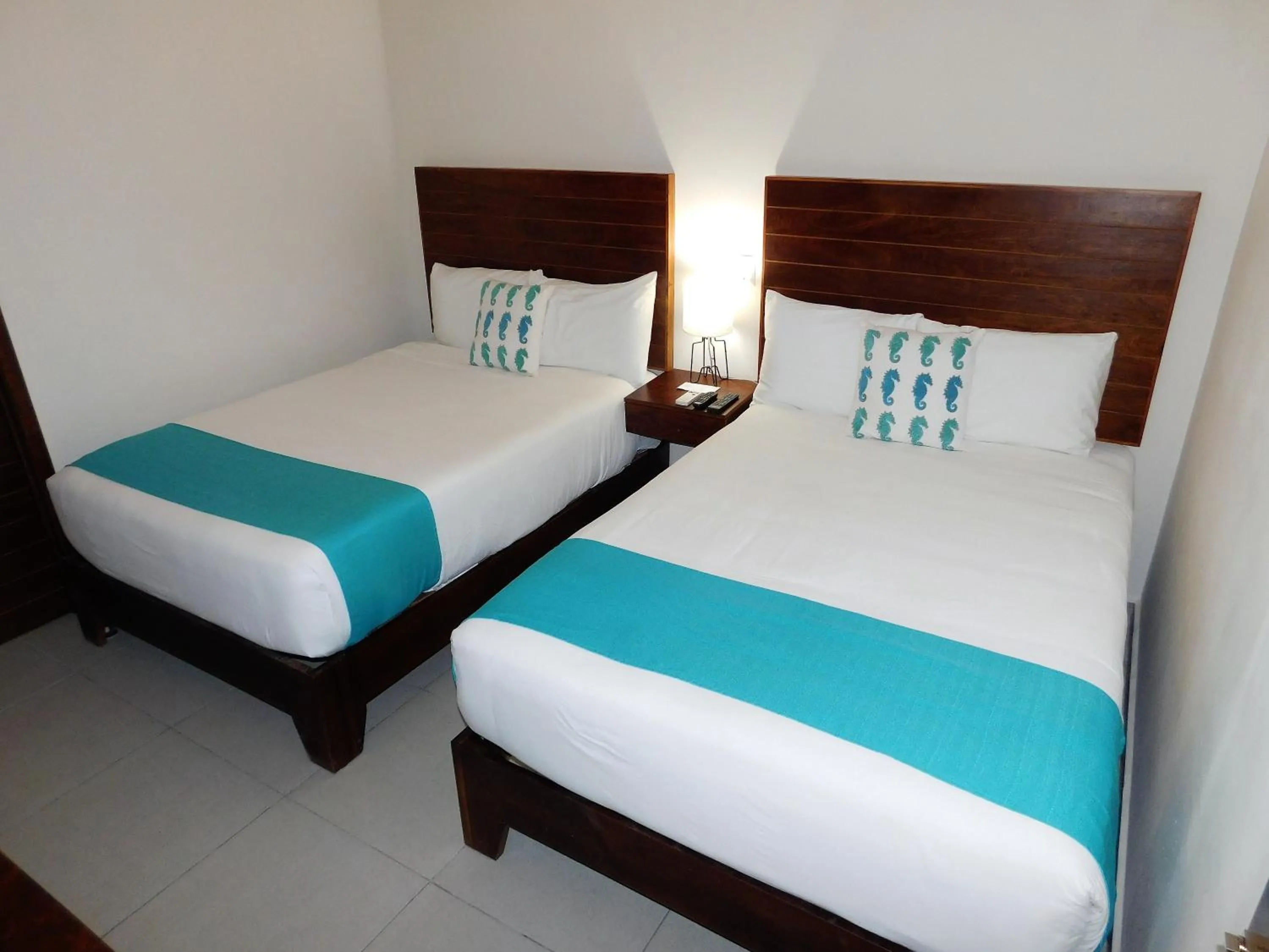 Bed in Aquastar Unique Hotel & Apartments Mahahual