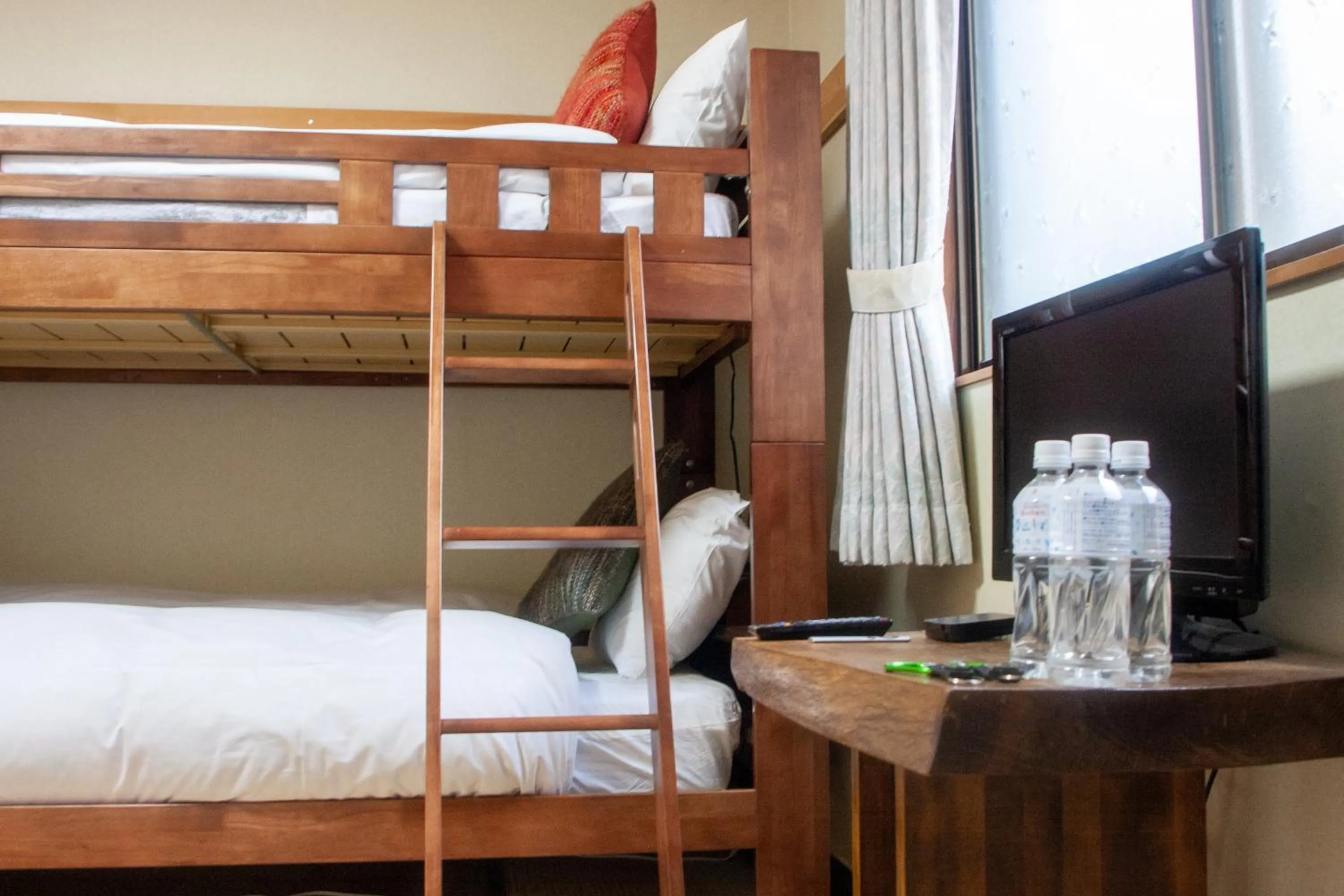 Bed in Kizuna Lodge & BBQ Centre