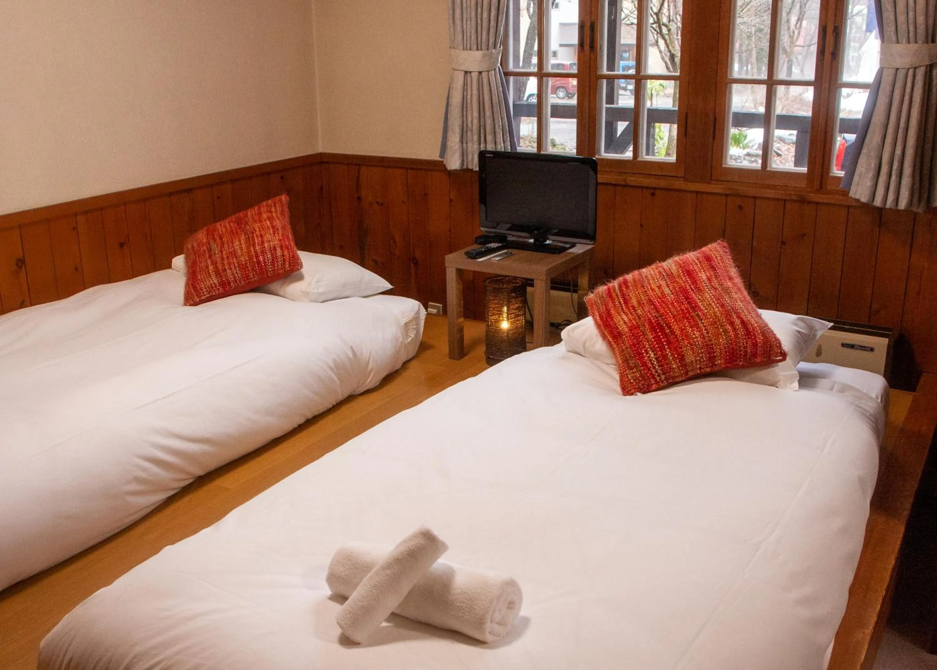 Bed in Kizuna Lodge & BBQ Centre