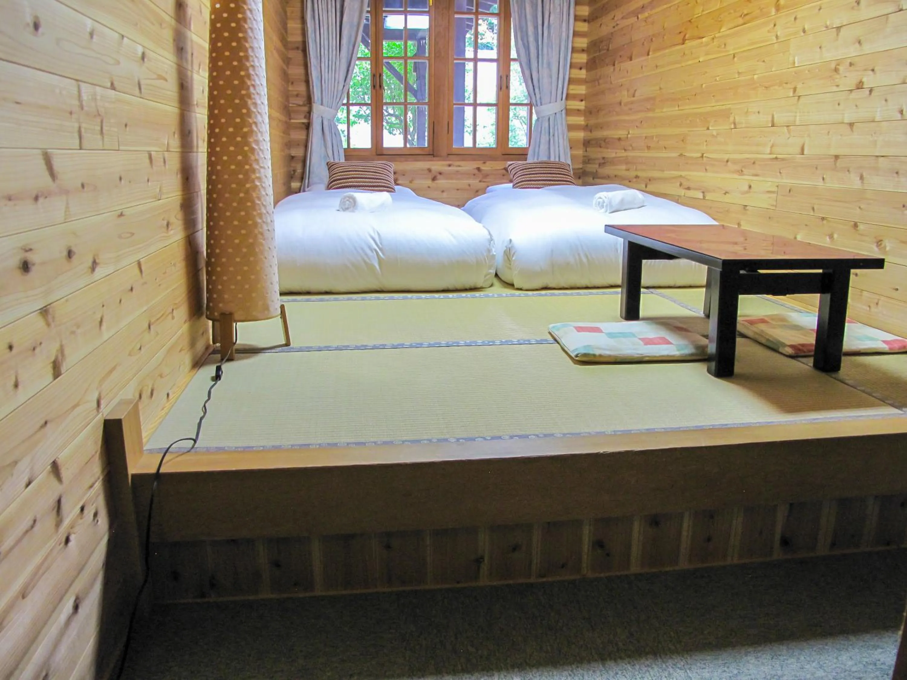 Bed in Kizuna Lodge & BBQ Centre
