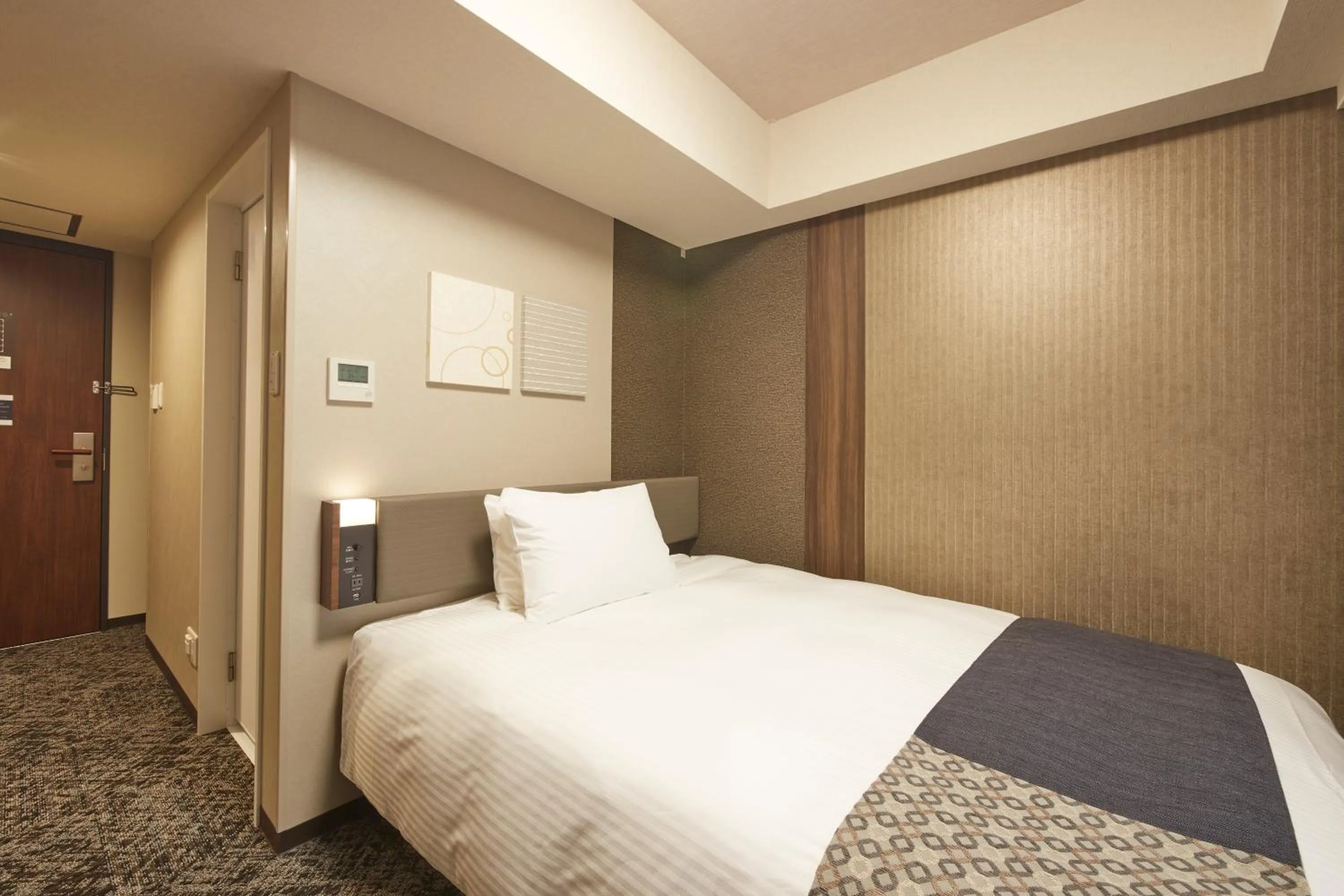 Bed in Iroha Grand Hotel Matsumoto Eki-Mae