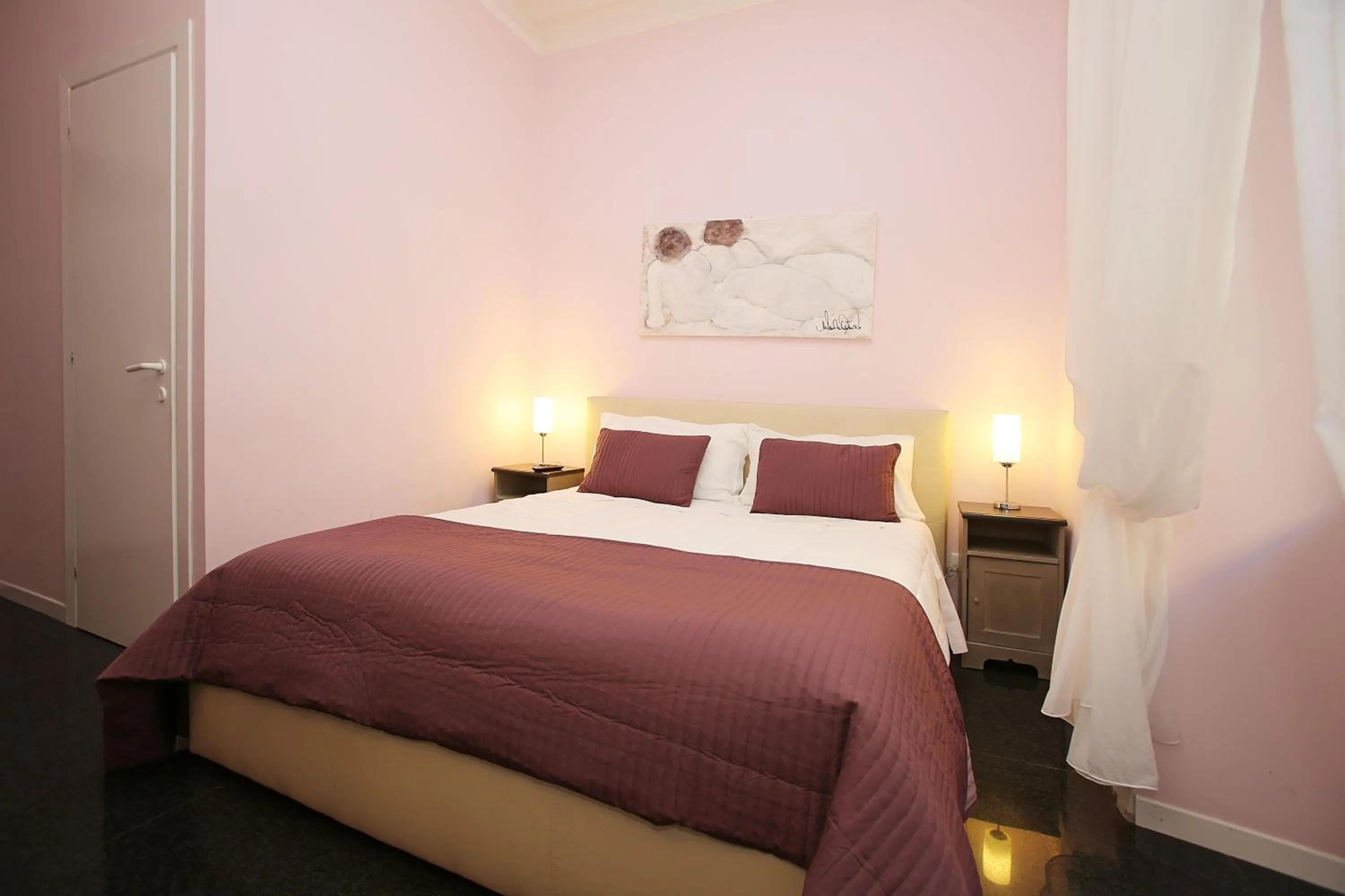 Bed in Amica Roma Guest House