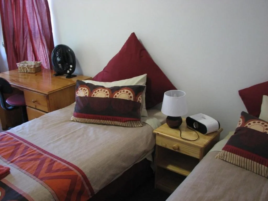 Bed in Magnolia Place Guest Houses