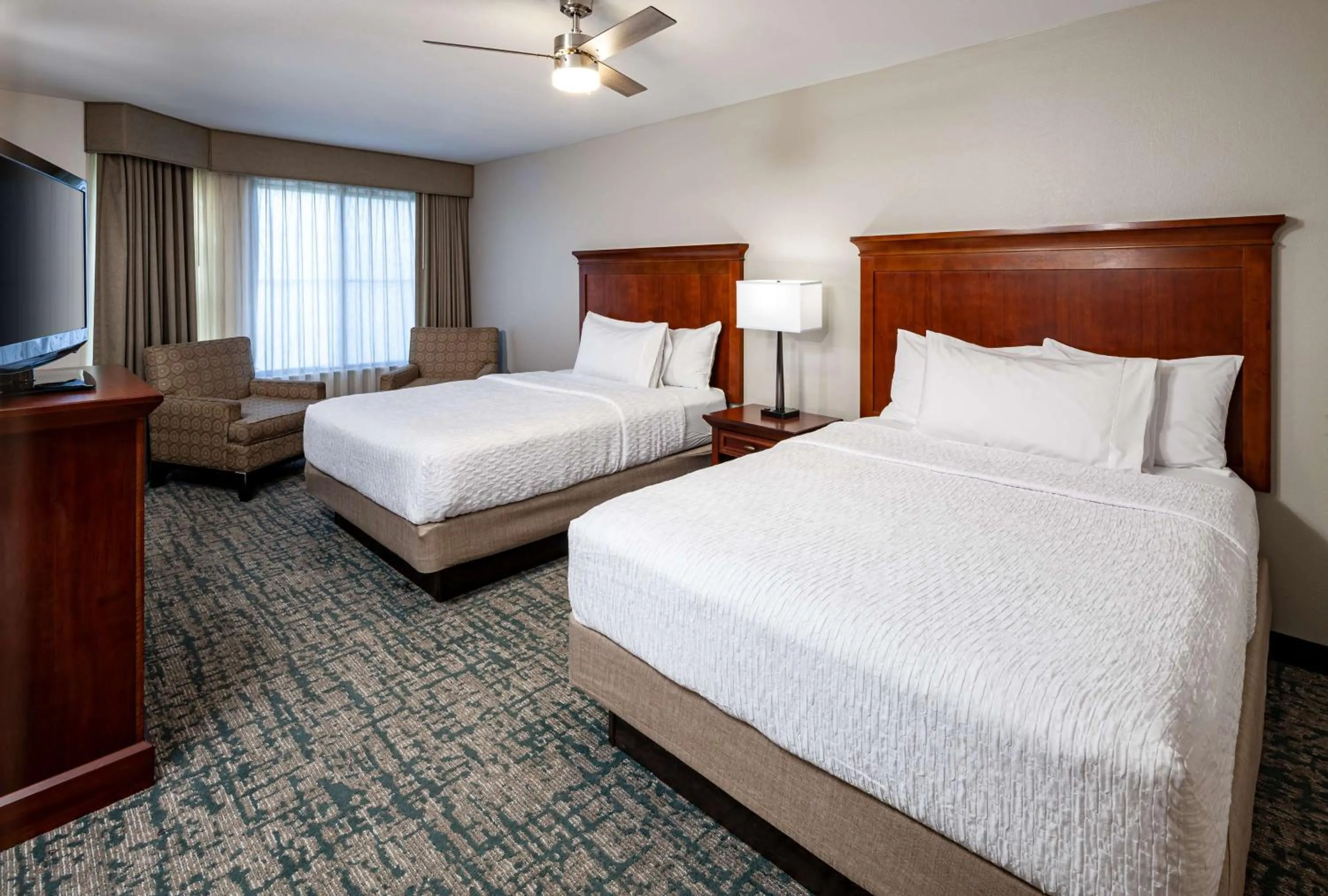 Bed in Homewood Suites by Hilton Gainesville
