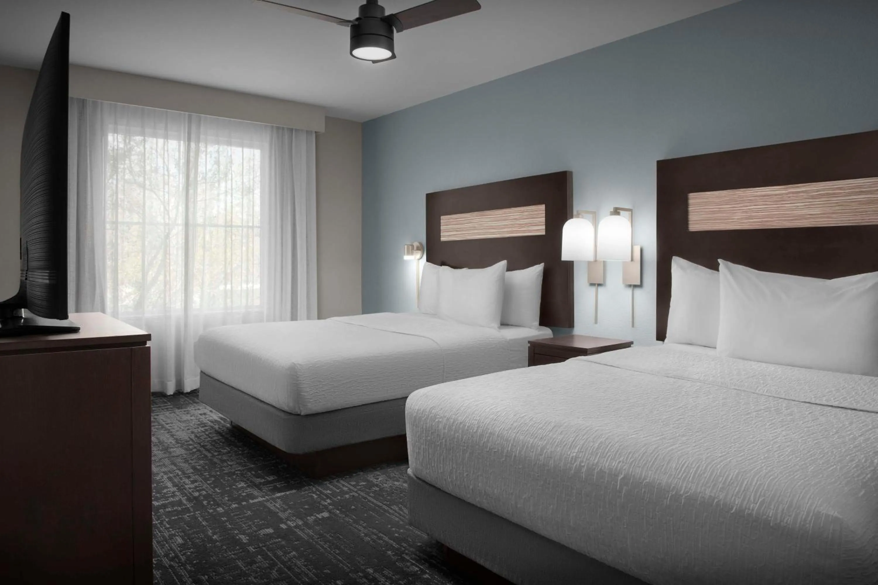 Bed in Homewood Suites by Hilton Orlando Airport