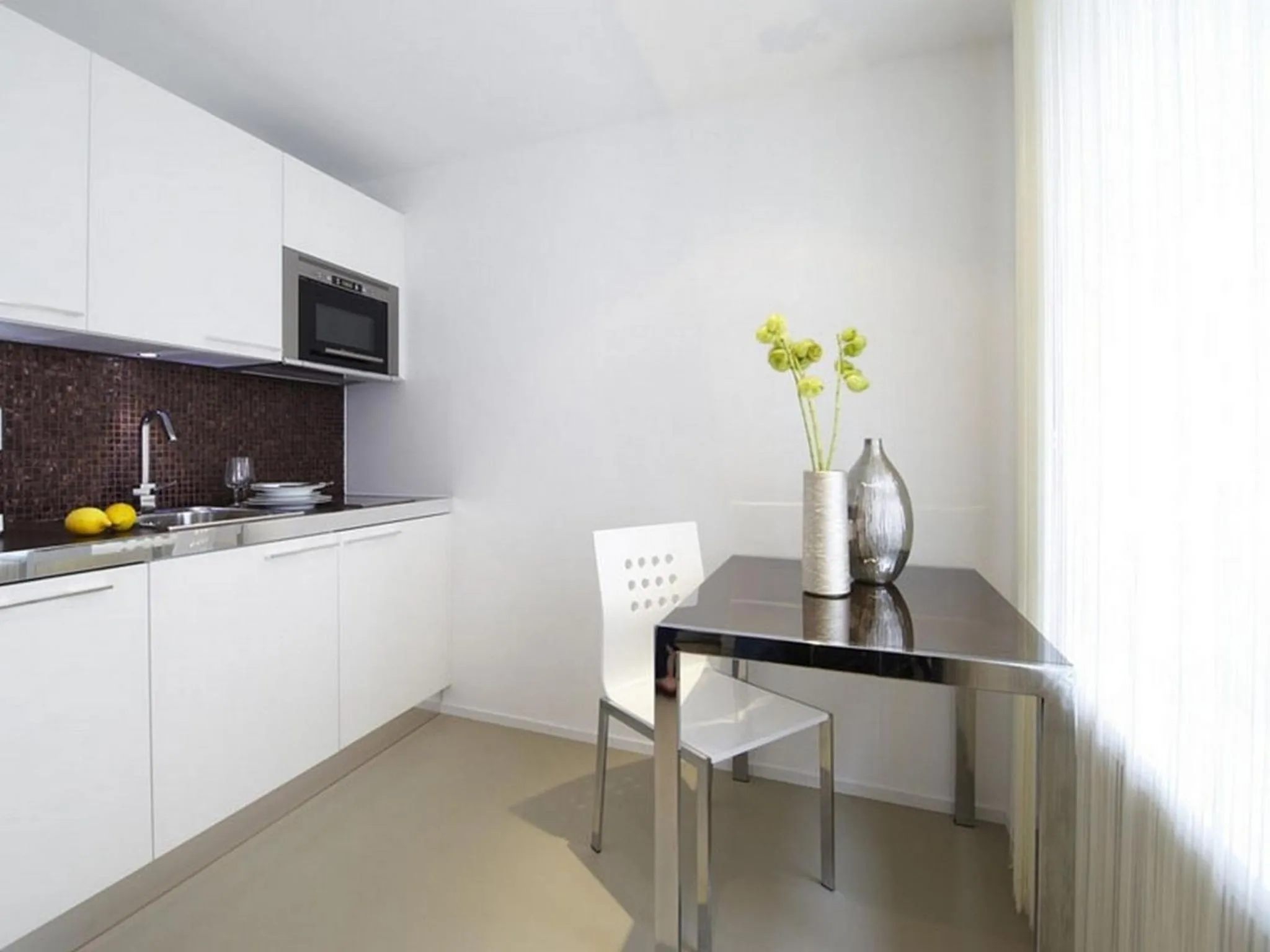 Kitchen or kitchenette in VISIONAPARTMENTS Zweierstrasse - contactless check-in
