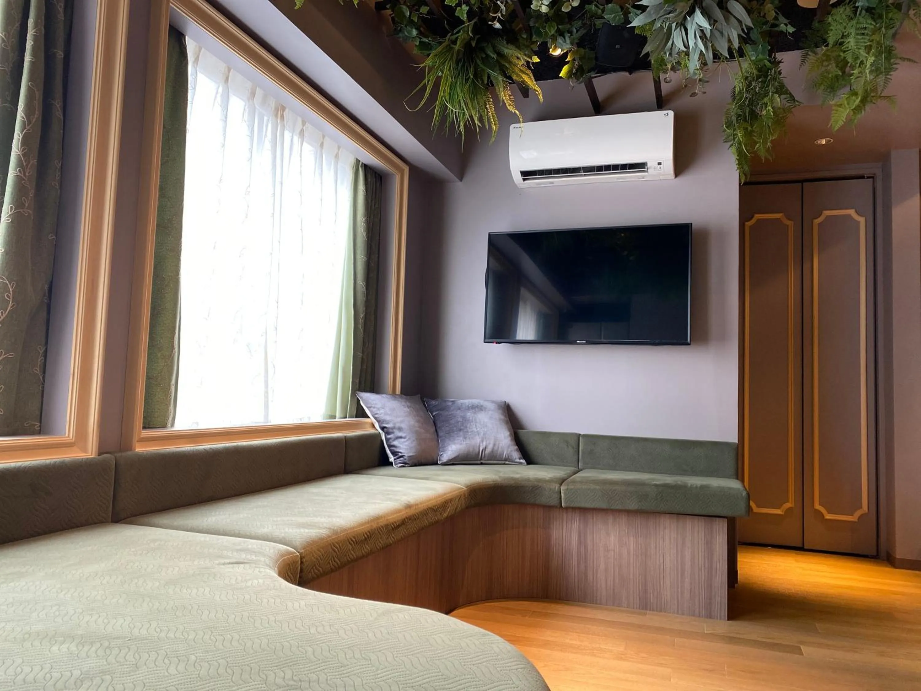 Communal lounge/ TV room, Bed in THE WARDROBE Hotel Shimokitazawa