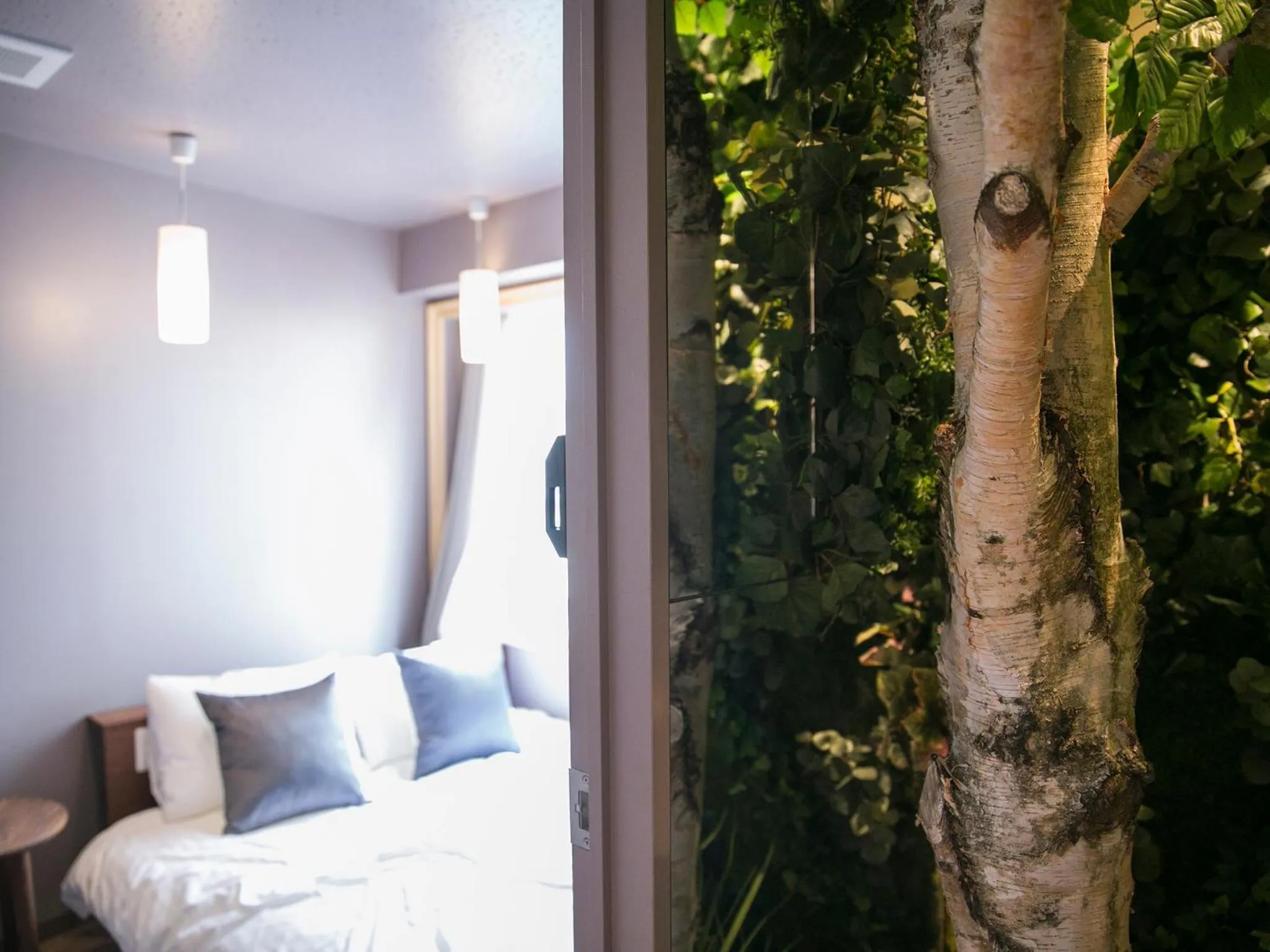 Bed in THE WARDROBE Hotel Shimokitazawa