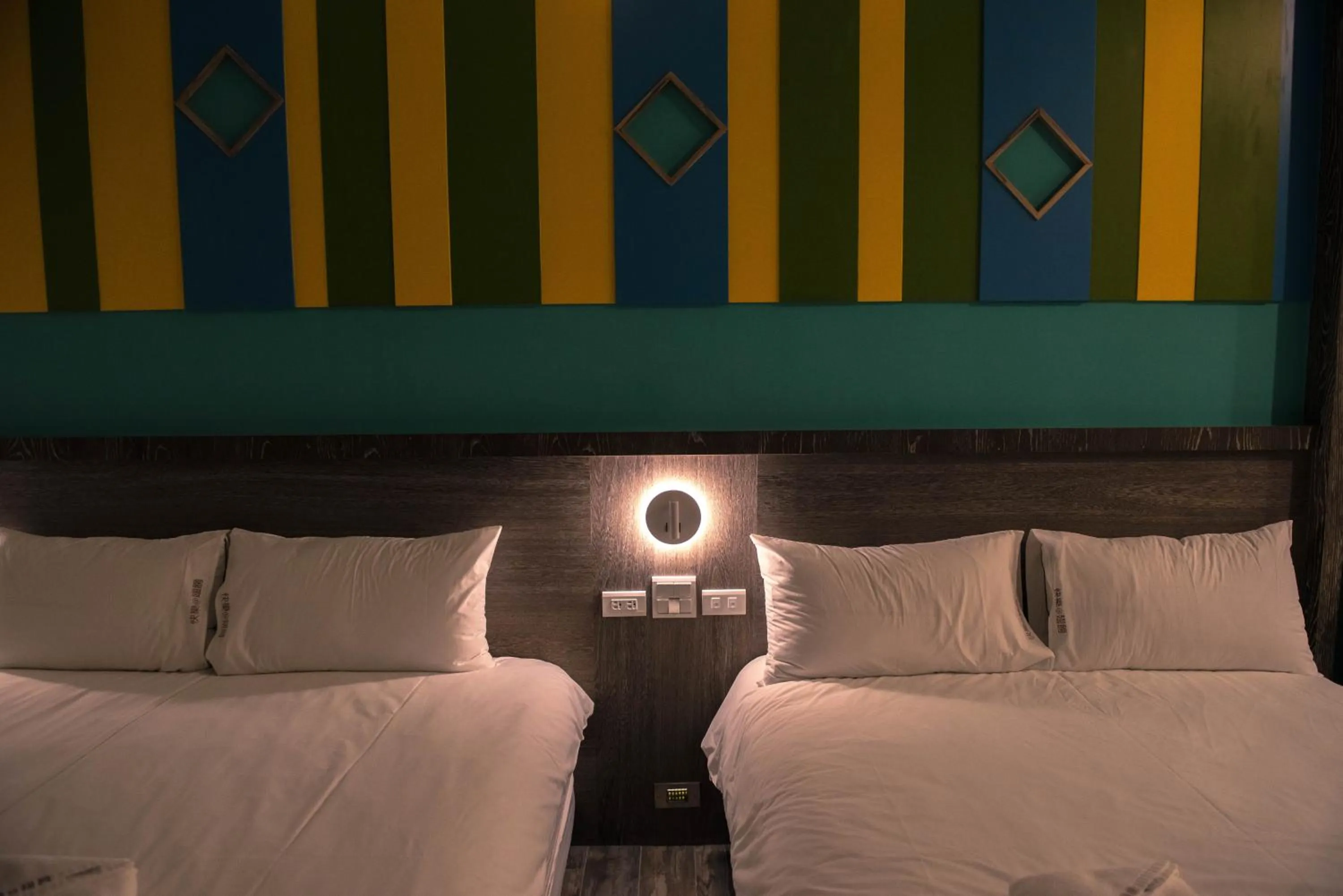 Bed in Happy Wing Guesthouse