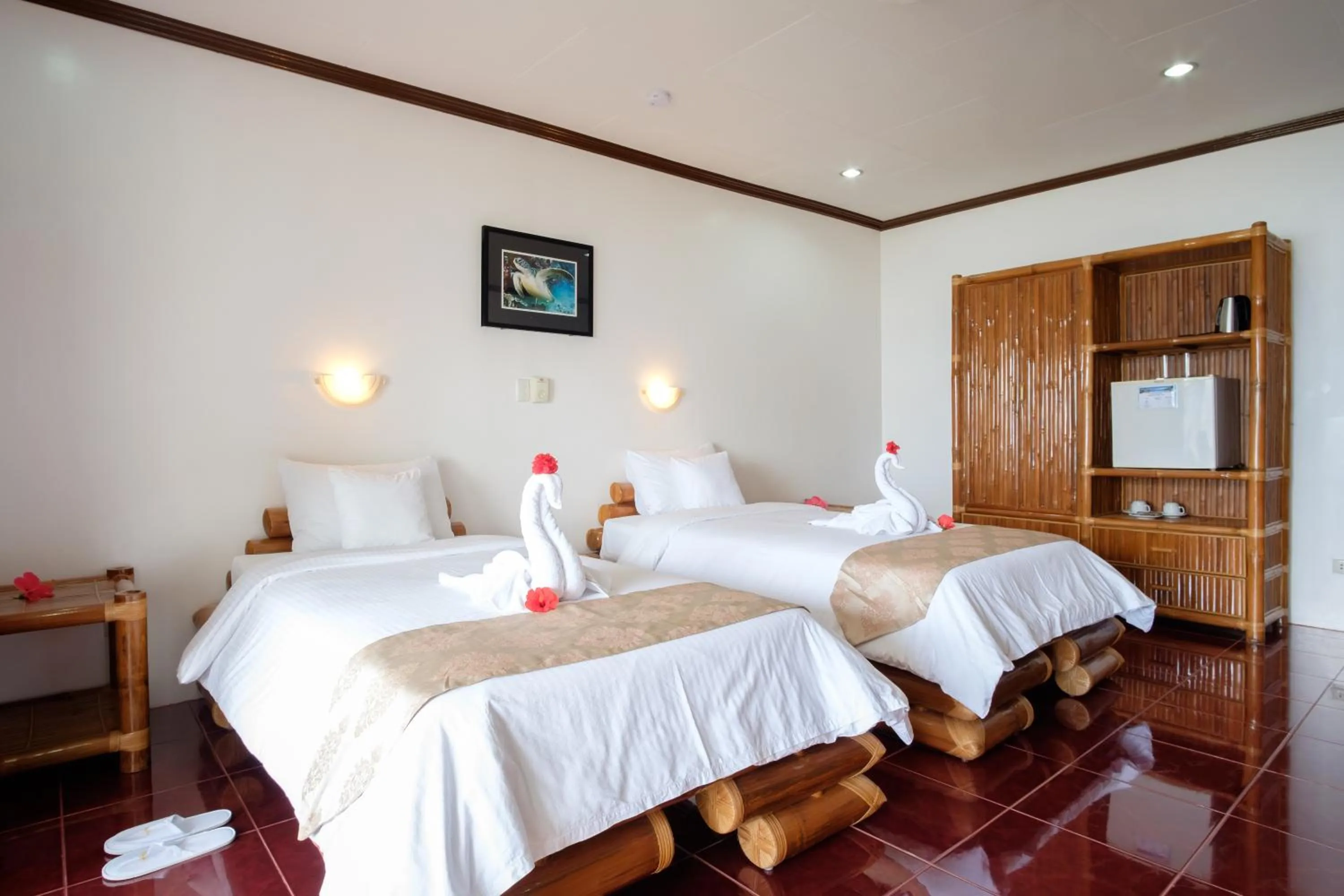 Bed in Kasai Village Dive Resort