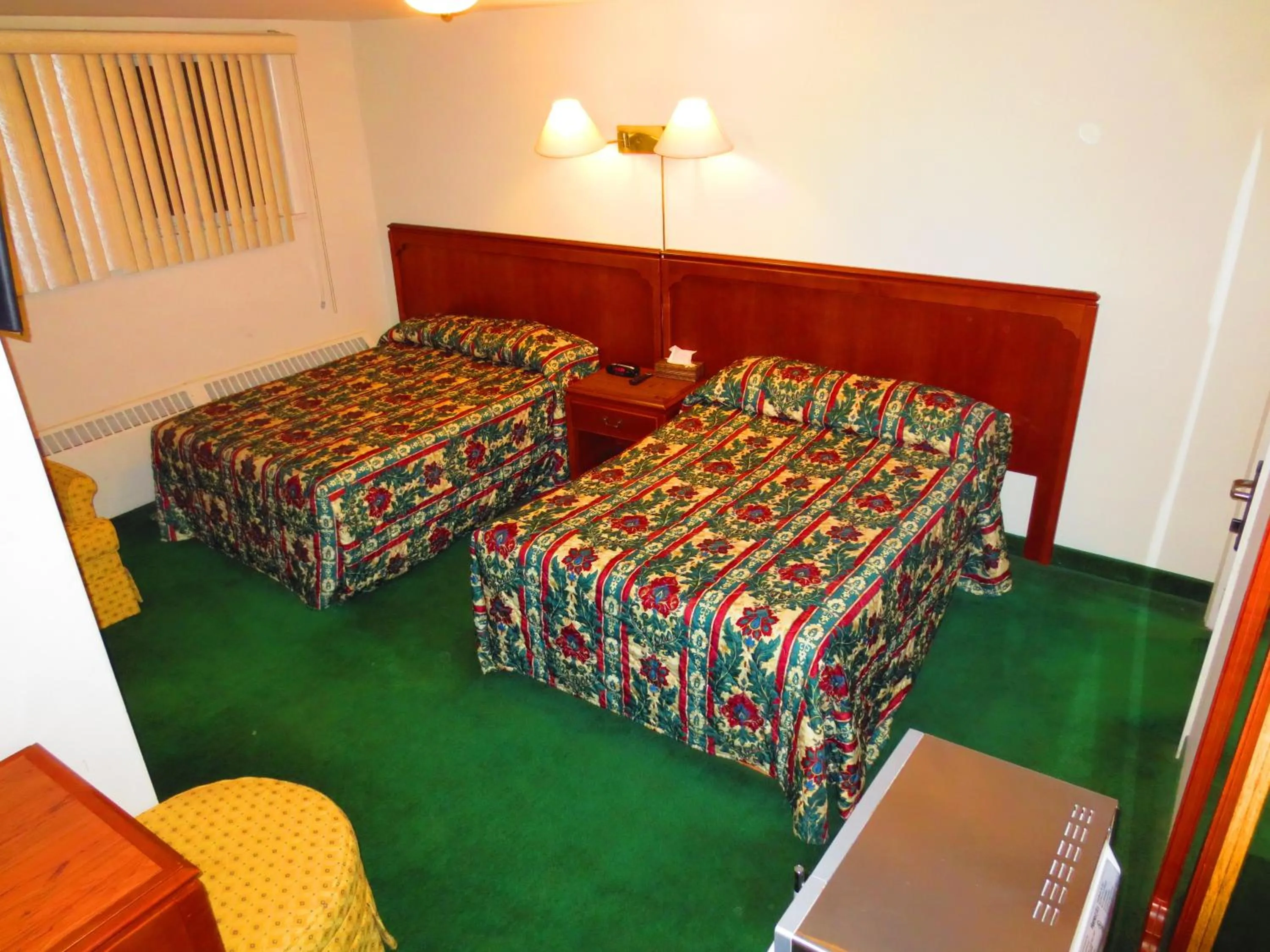 Bed in Canadiana Motel