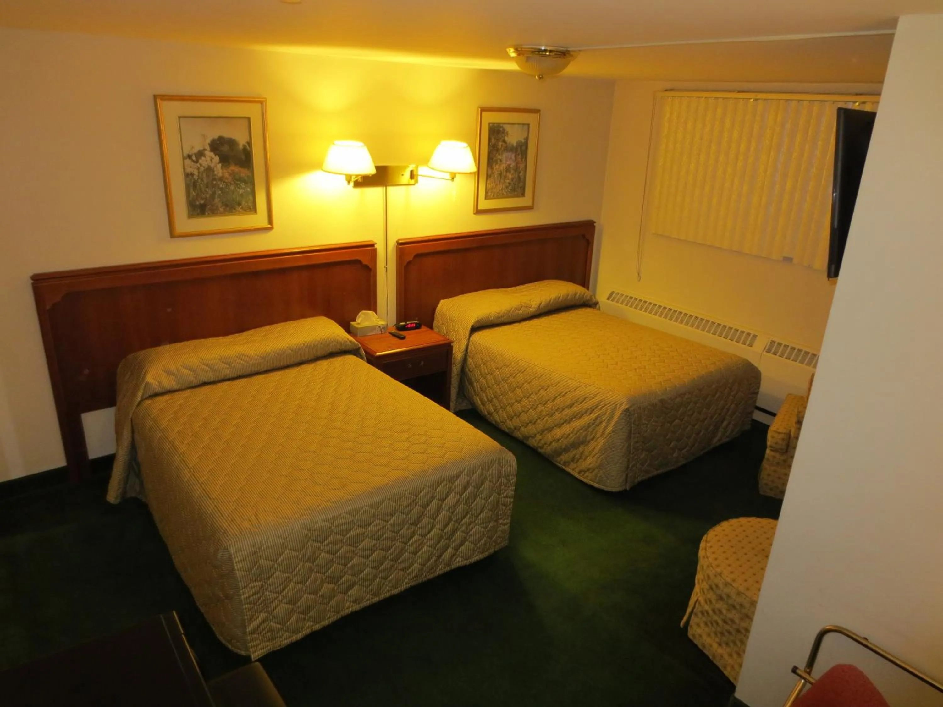 Bed in Canadiana Motel