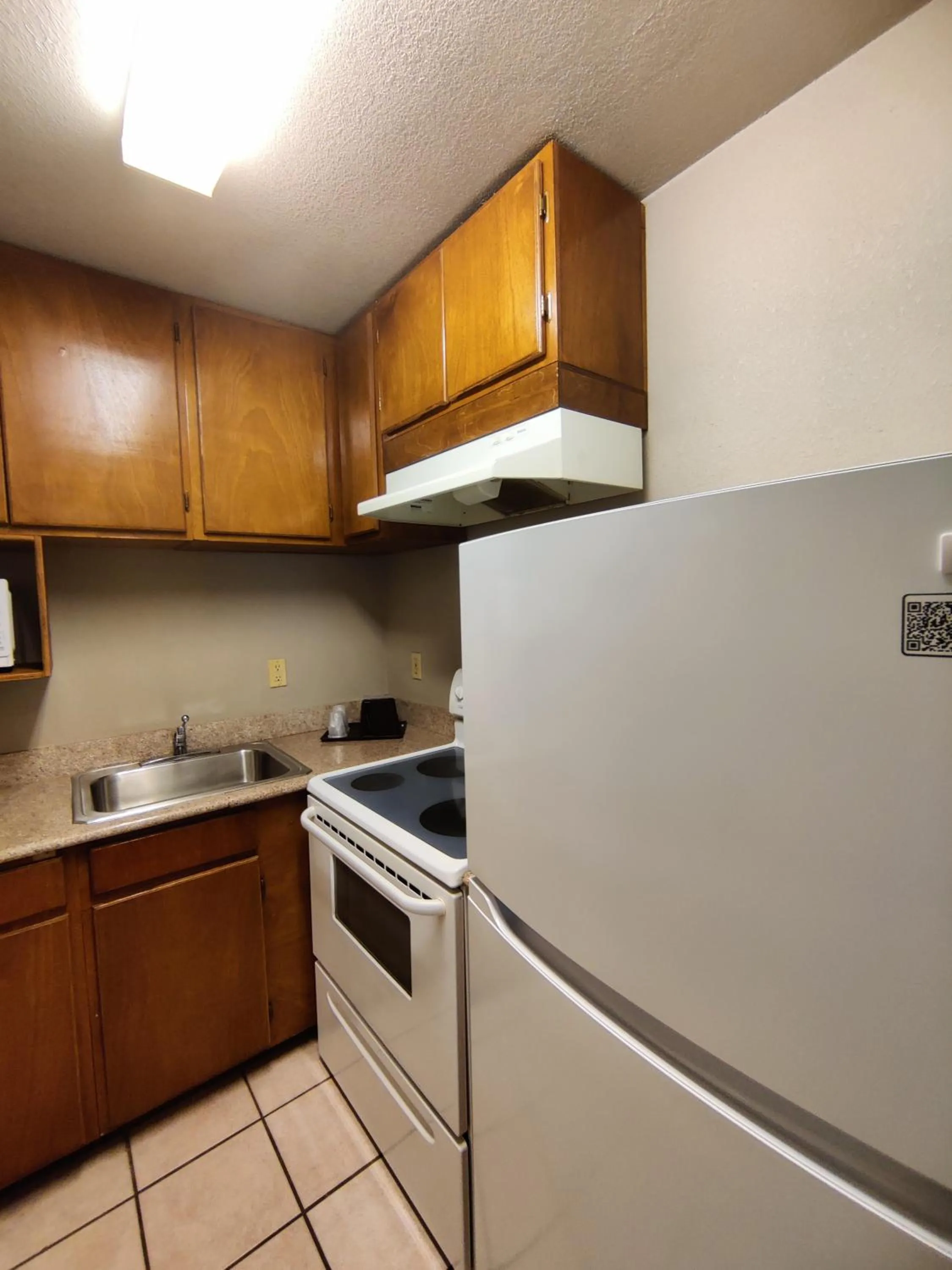 Kitchen or kitchenette in Regency Inn & Suites By Capital O Houston IAH Airport