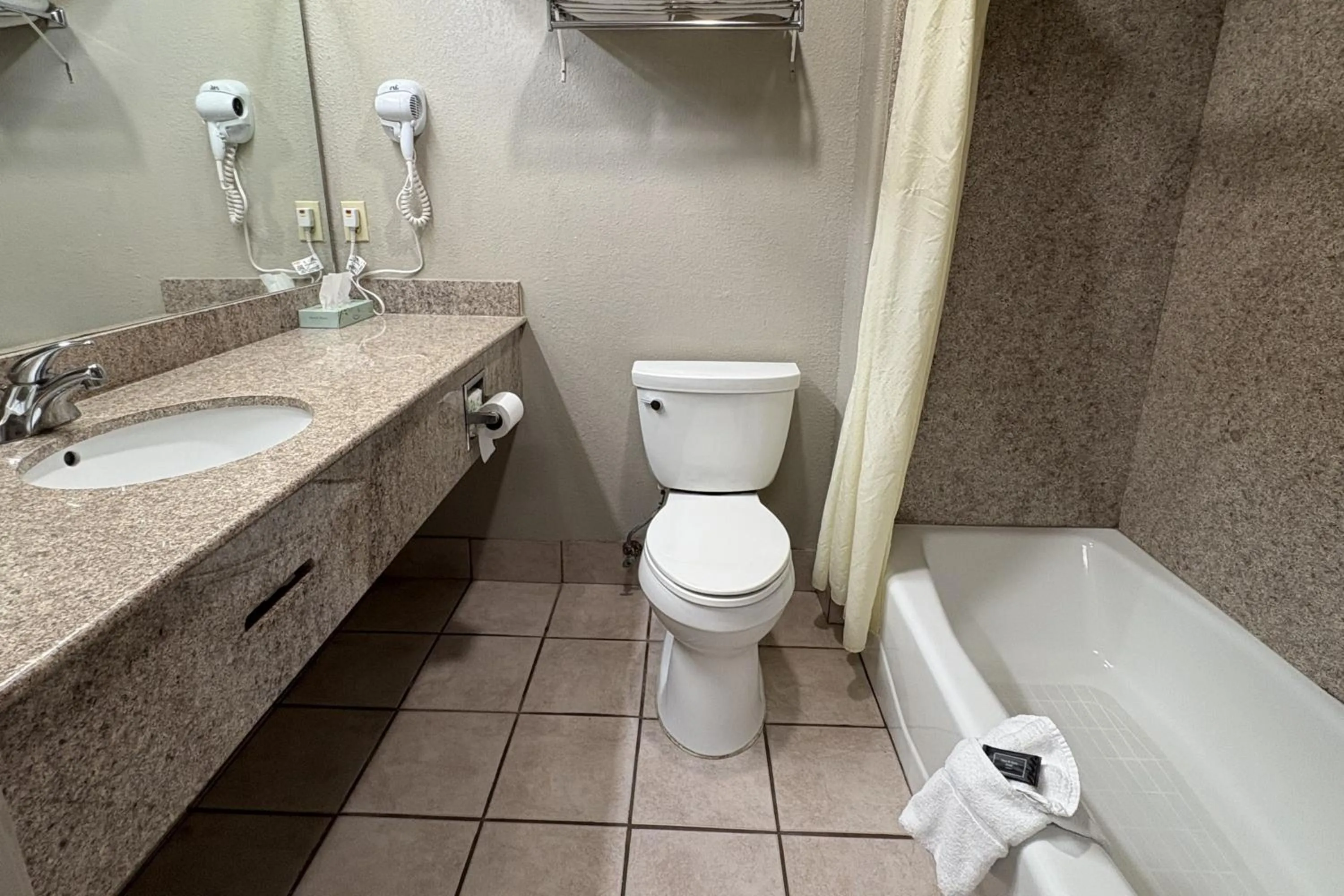 Bathroom in Regency Inn & Suites By Capital O Houston IAH Airport