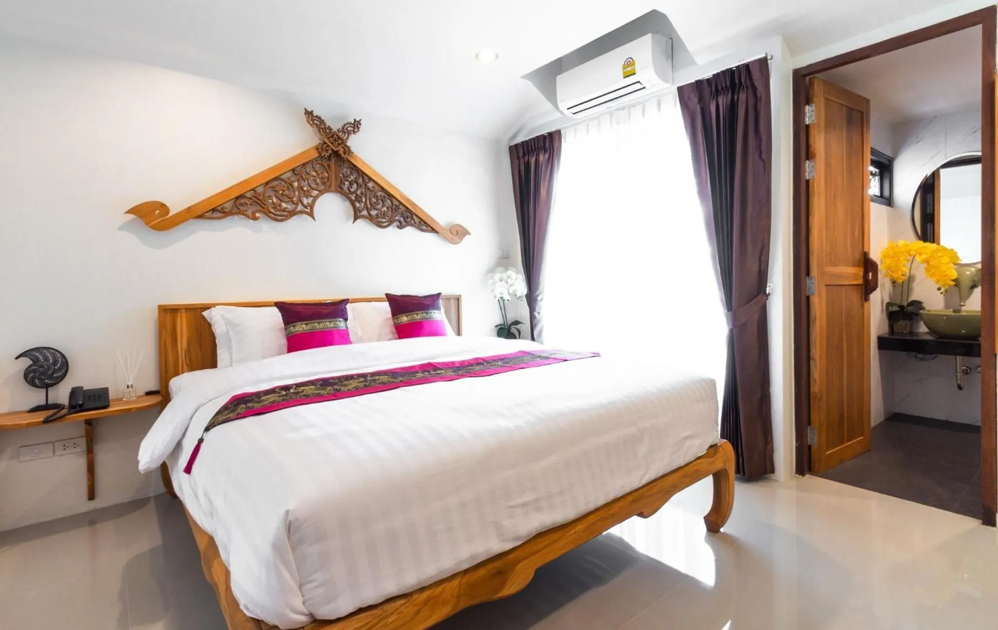 Bed in Anumat Premium Budget Hotel