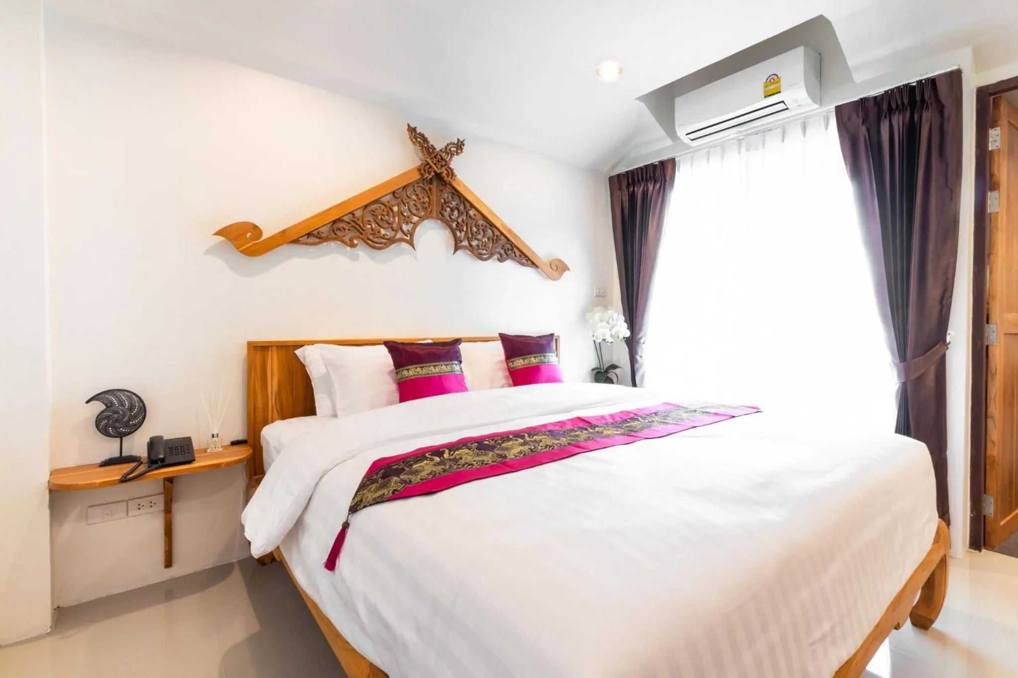 Bed in Anumat Premium Budget Hotel