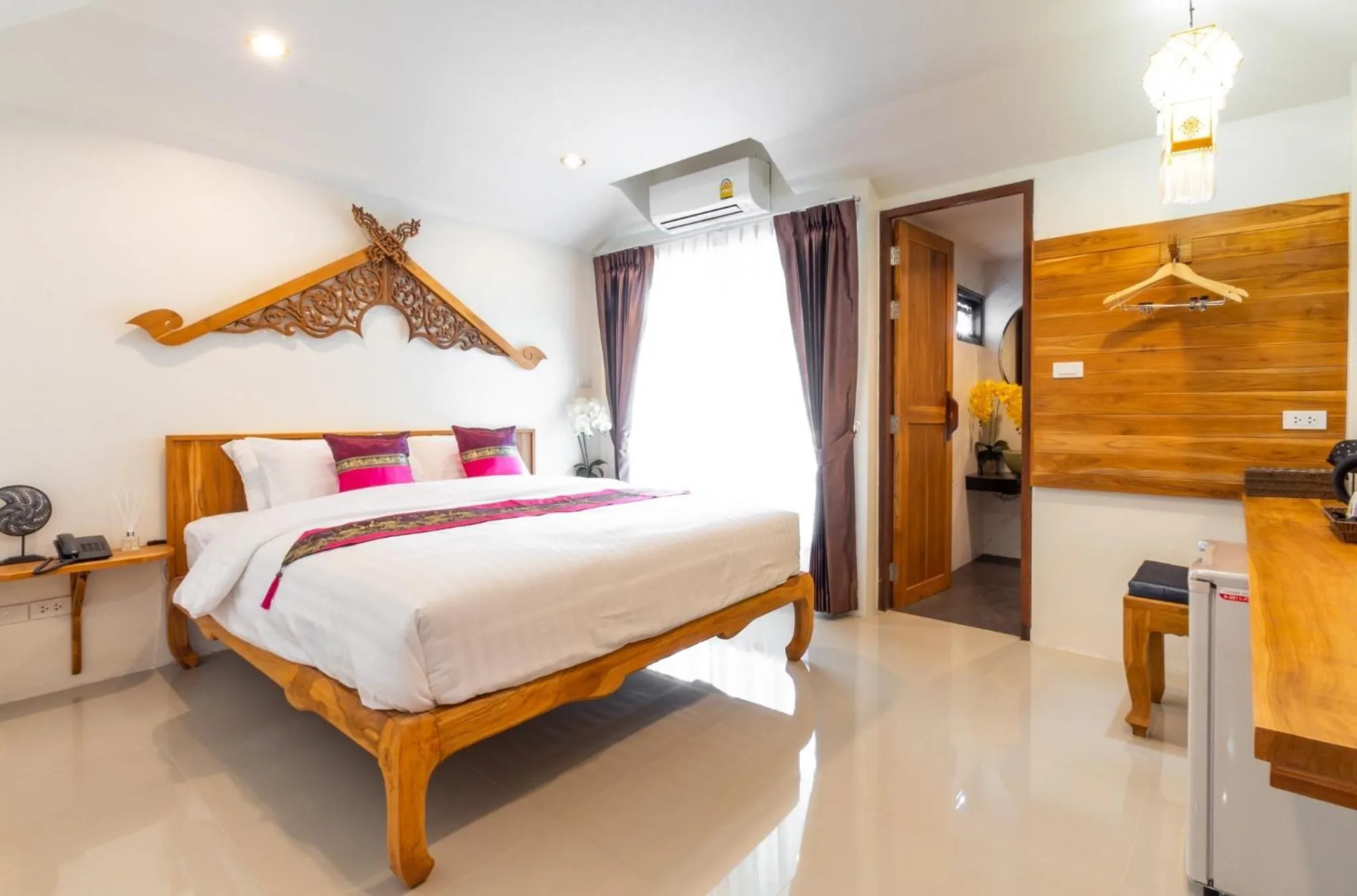 Bed in Anumat Premium Budget Hotel