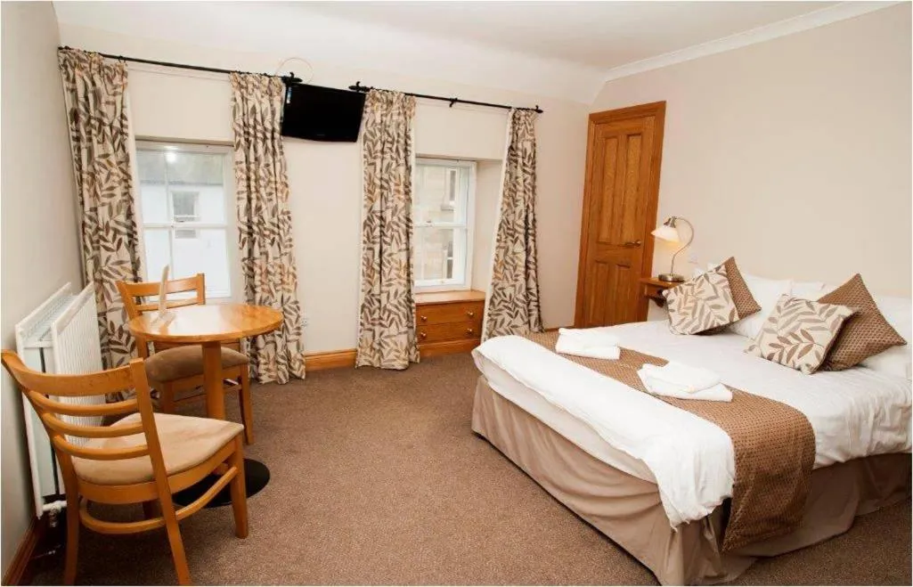 Bed in The Spread Eagle Hotel