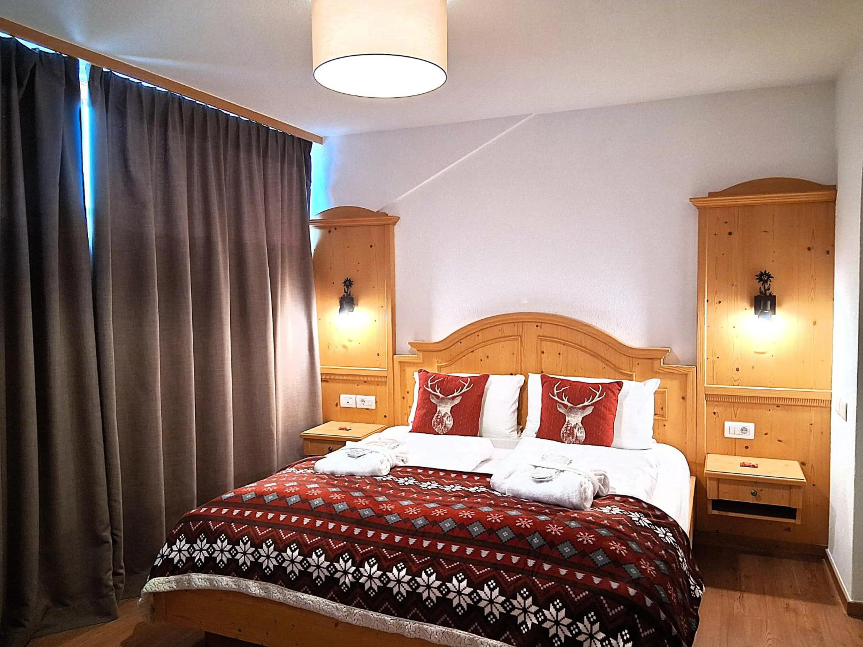 Bed in Hotel Kronplatzer Hof