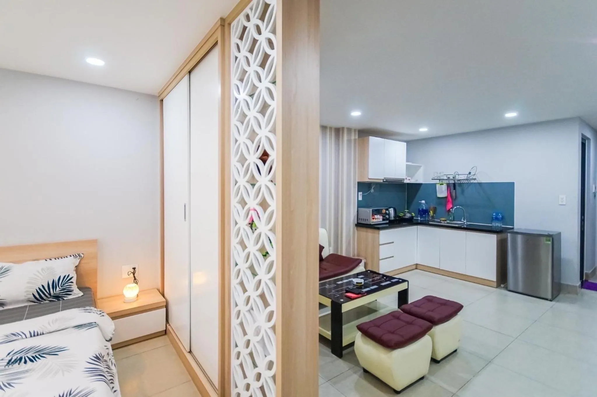 Living room, Bed in GEM Apartment